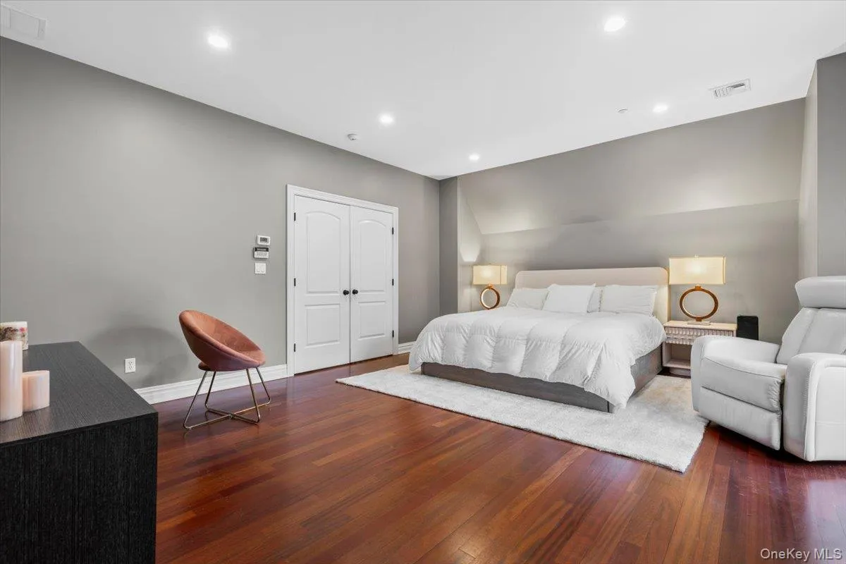 Serene primary suite layout illuminated by recessed lighting and a neutral color palette. Serene primary suite layout illuminated by recessed lighting and a neutral color palette.