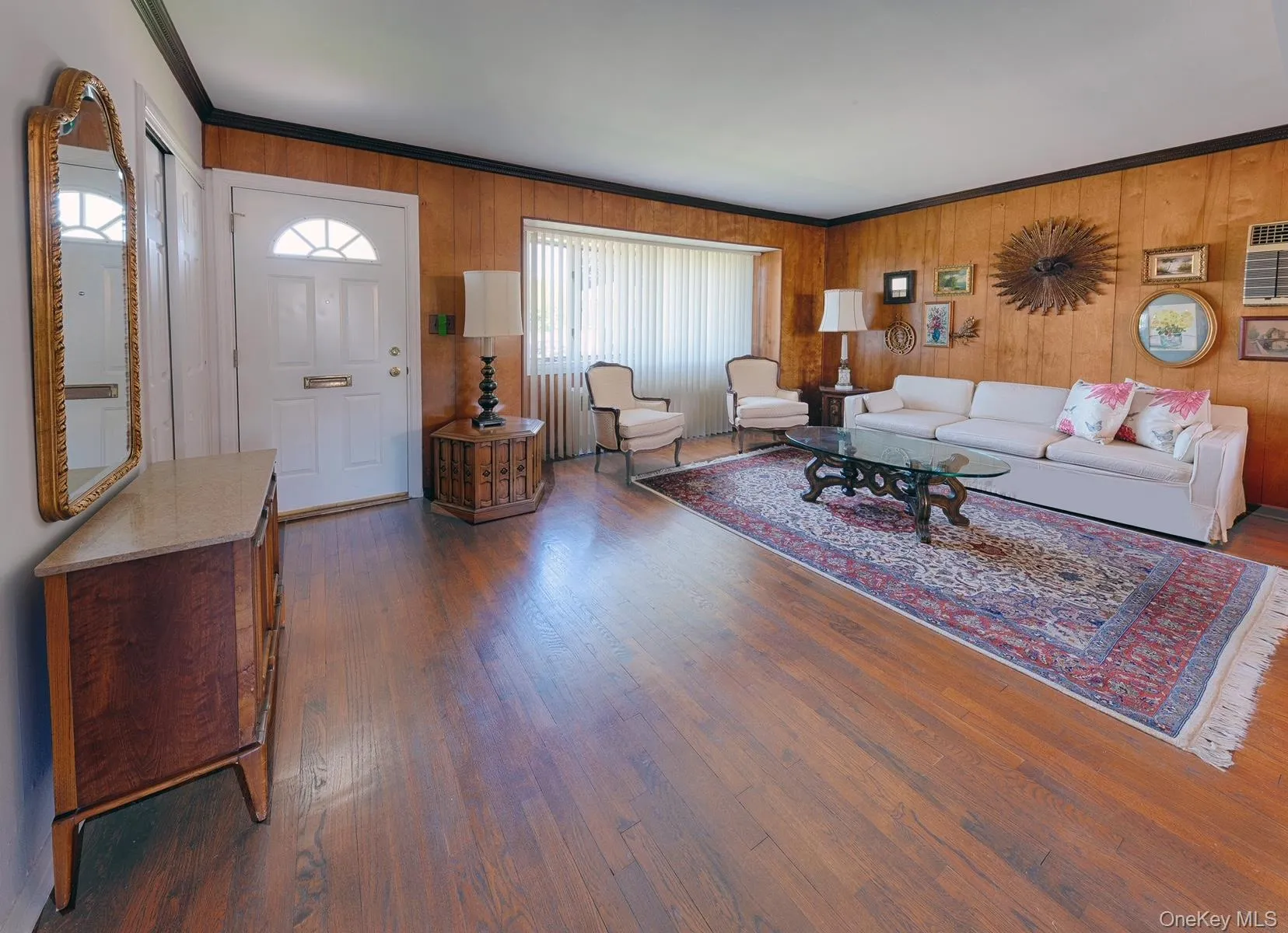 Entryway into Living Room featuring a paneled door with an arched window Entryway into Living Room featuring a paneled door with an arched window