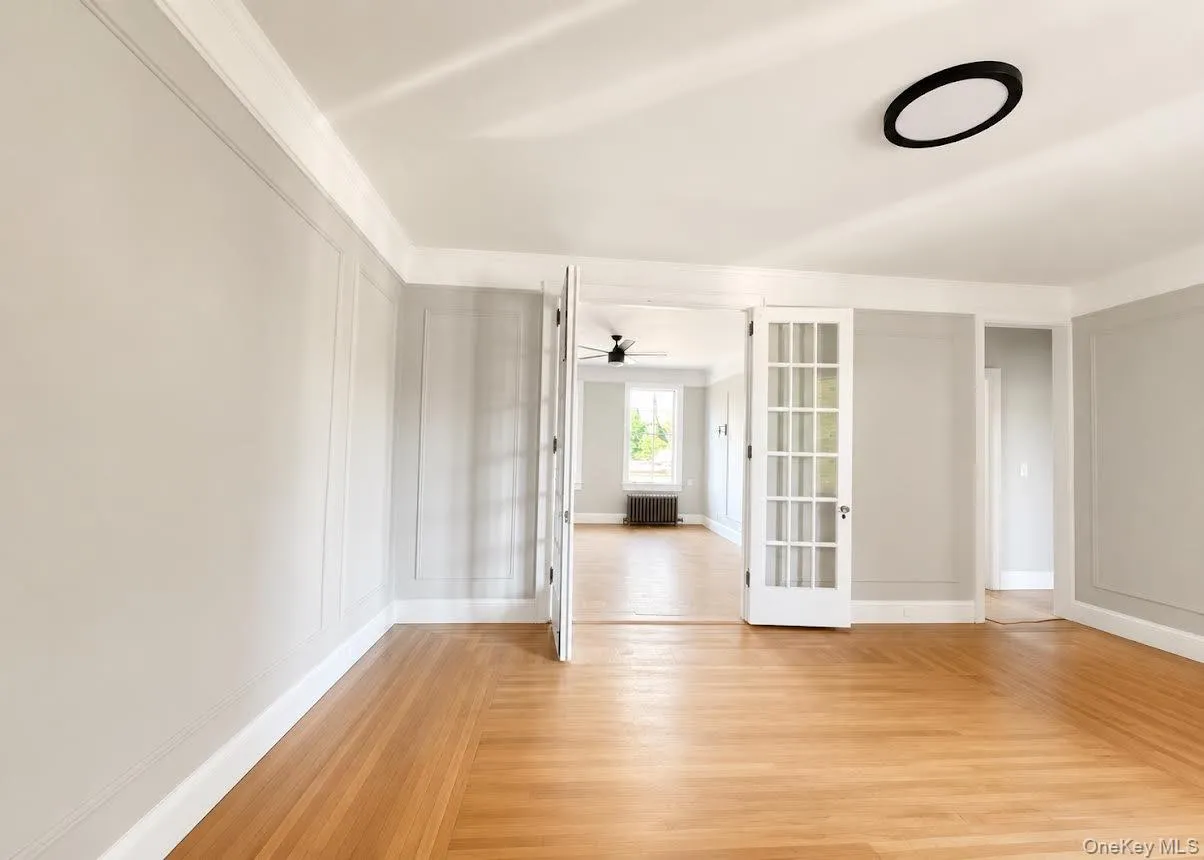 Living room toward two bedrooms facing front of building Living room toward two bedrooms facing front of building
