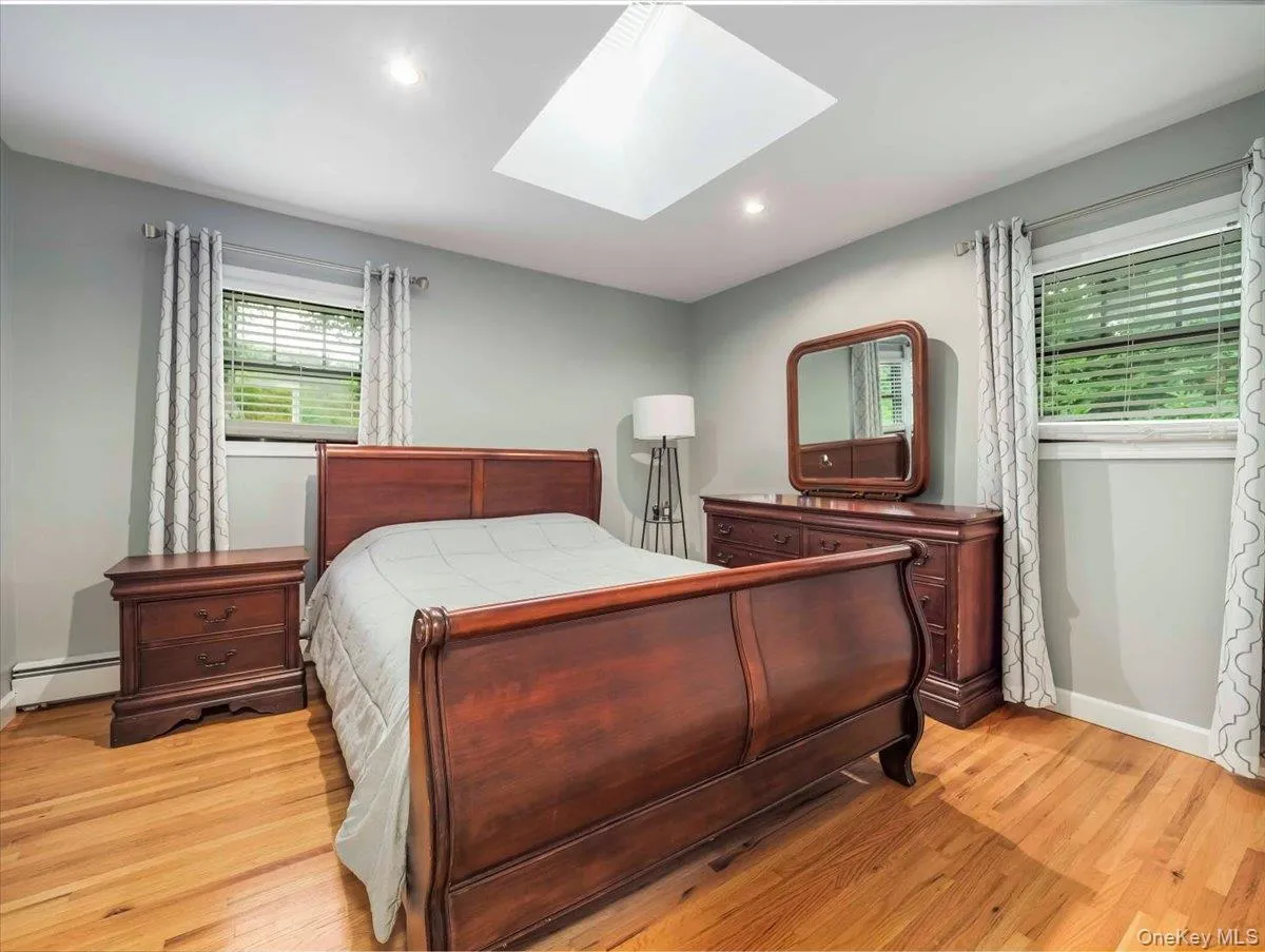 Hardwood flooring complemented by a skylight and recessed lighting Hardwood flooring complemented by a skylight and recessed lighting