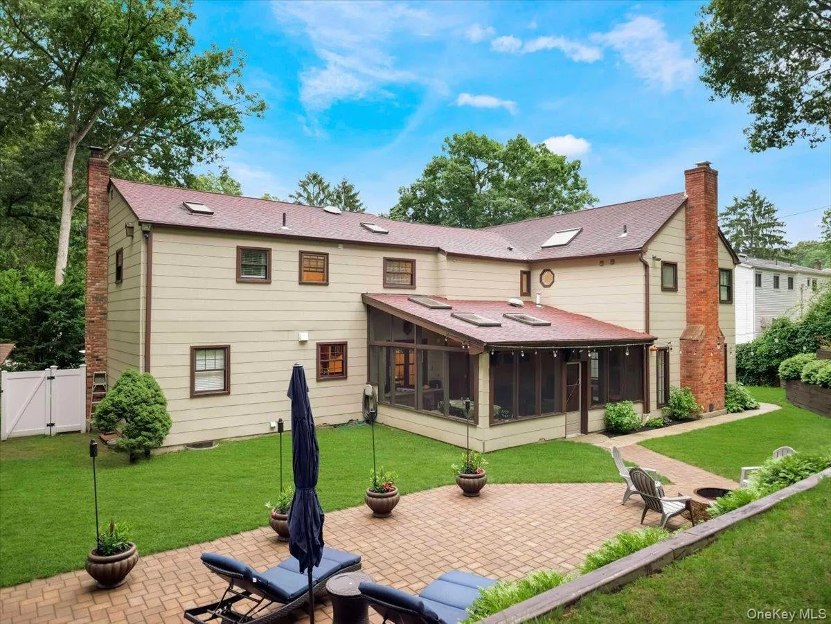 Expansive paver patio with a built-in fire pit Expansive paver patio with a built-in fire pit
