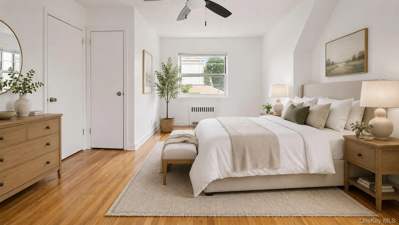 Hardwood flooring complements white walls and a ceiling fan Hardwood flooring complements white walls and a ceiling fan