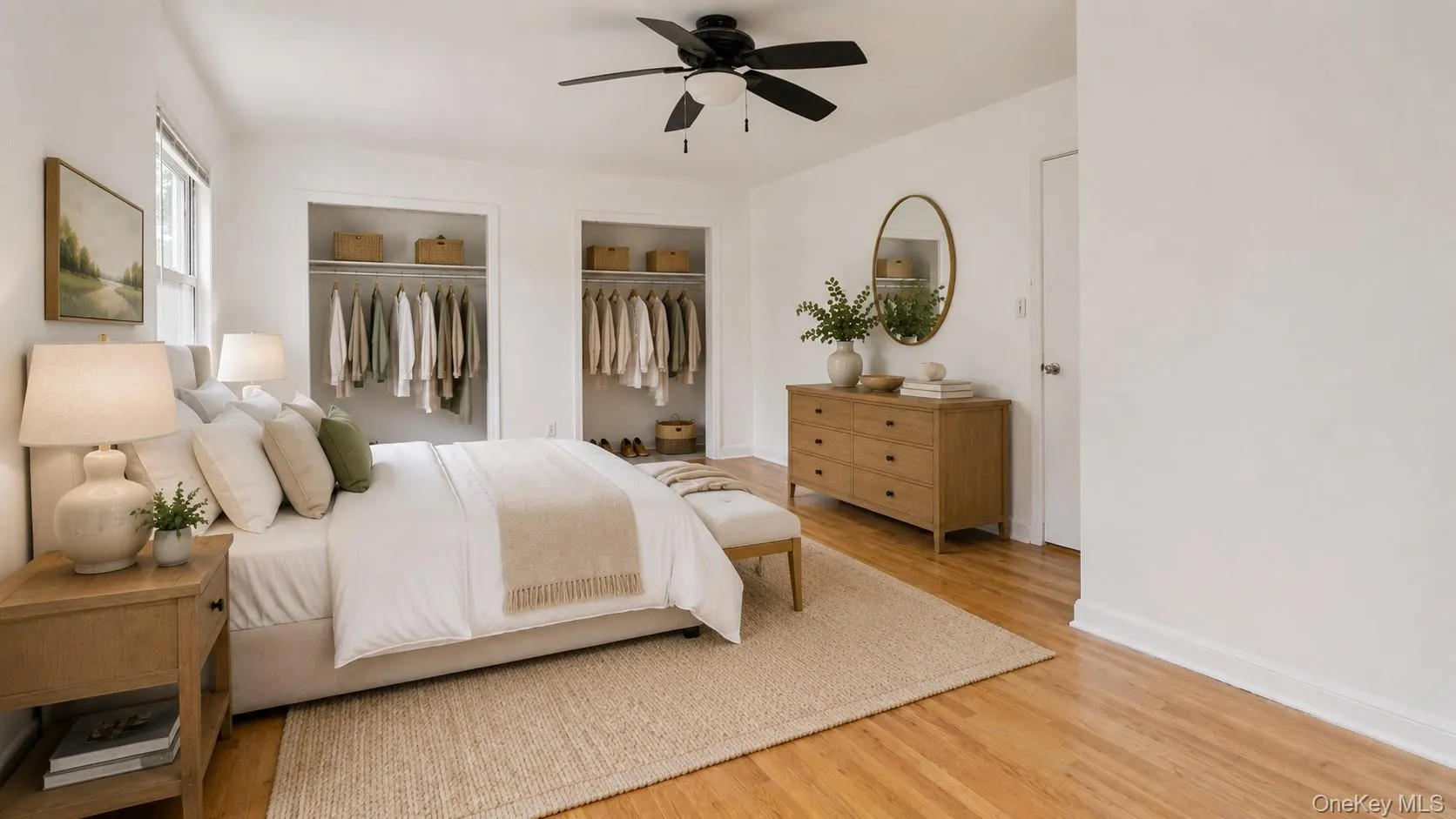 Hardwood flooring complements white walls and a ceiling fan Hardwood flooring complements white walls and a ceiling fan