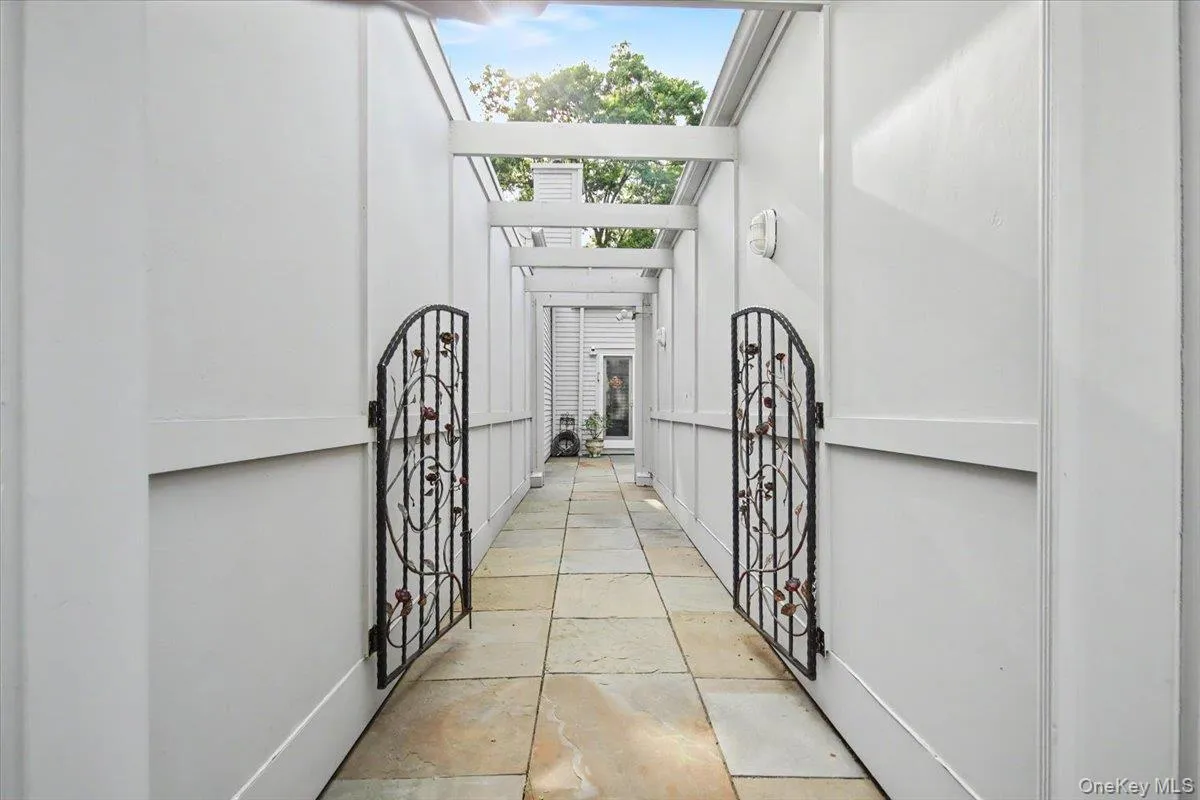 Path with decorative iron gate leading from driveway to your next home! Path with decorative iron gate leading from driveway to your next home!