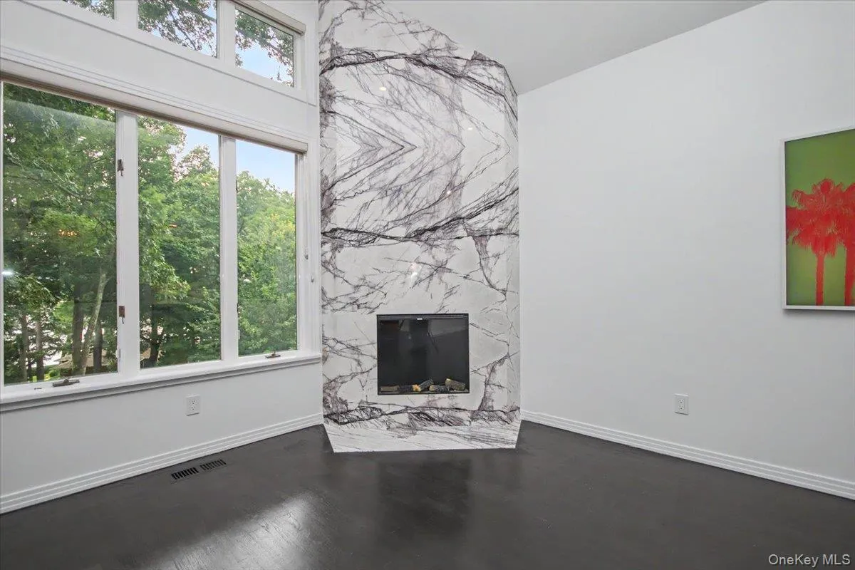 The newly installed marble fireplace surround is a piece of art. Natural light is abundant! The newly installed marble fireplace surround is a piece of art. Natural light is abundant!