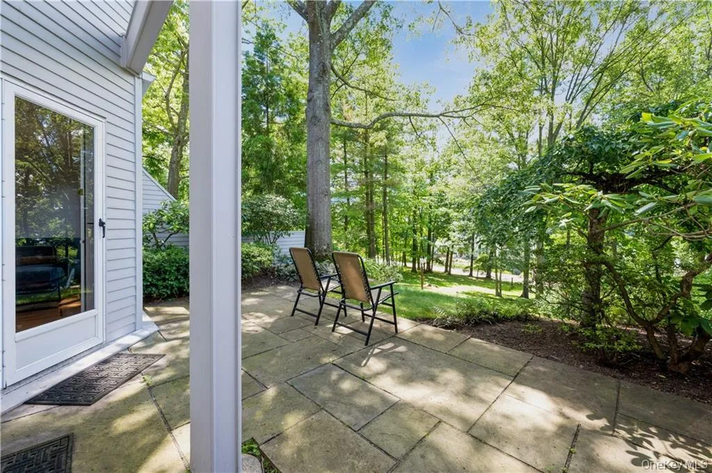 Paved stone patio accessible from both lower level bedroms. Paved stone patio accessible from both lower level bedroms.