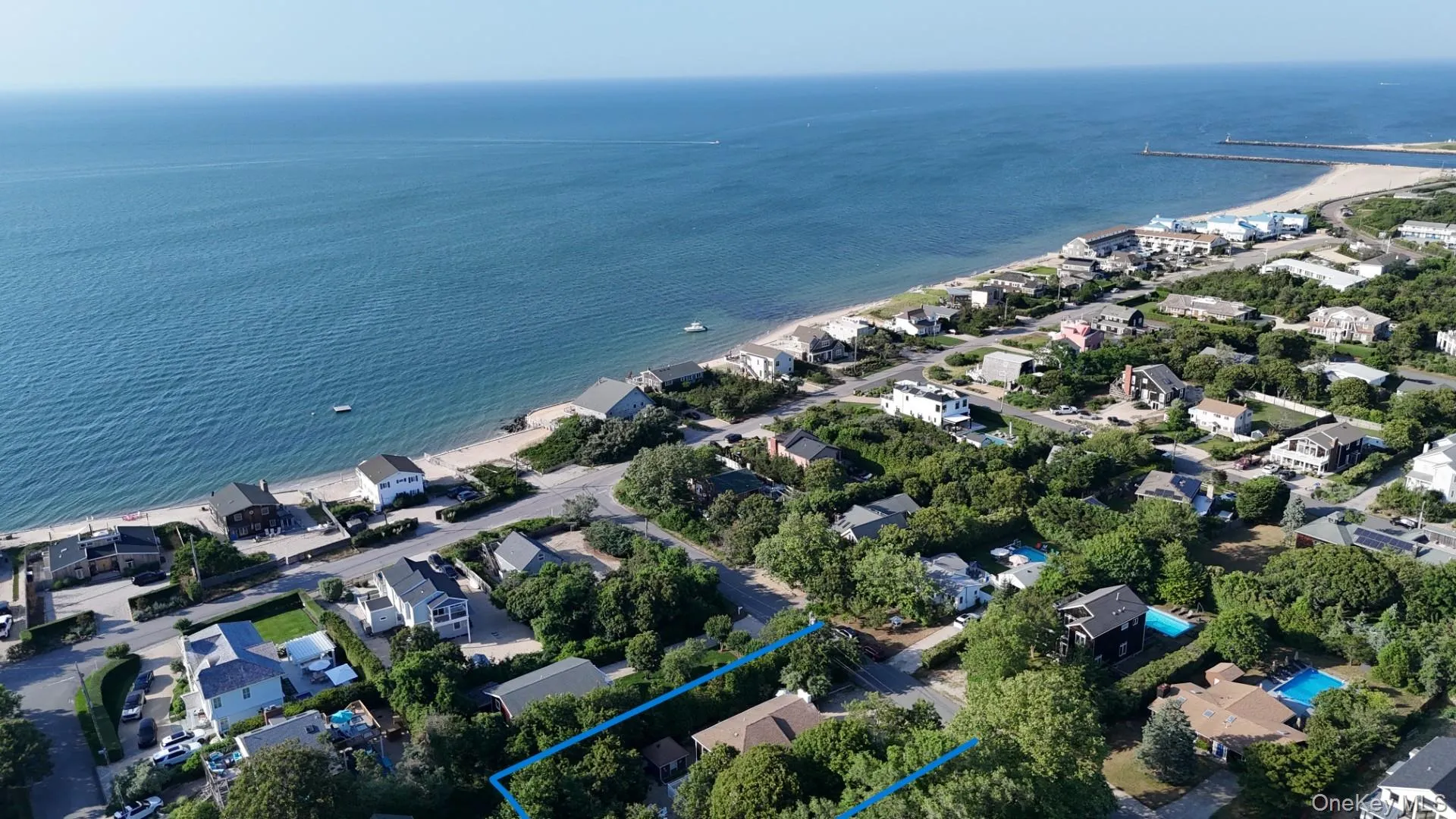 Coastal property offering water frontage and sandy beach access Coastal property offering water frontage and sandy beach access