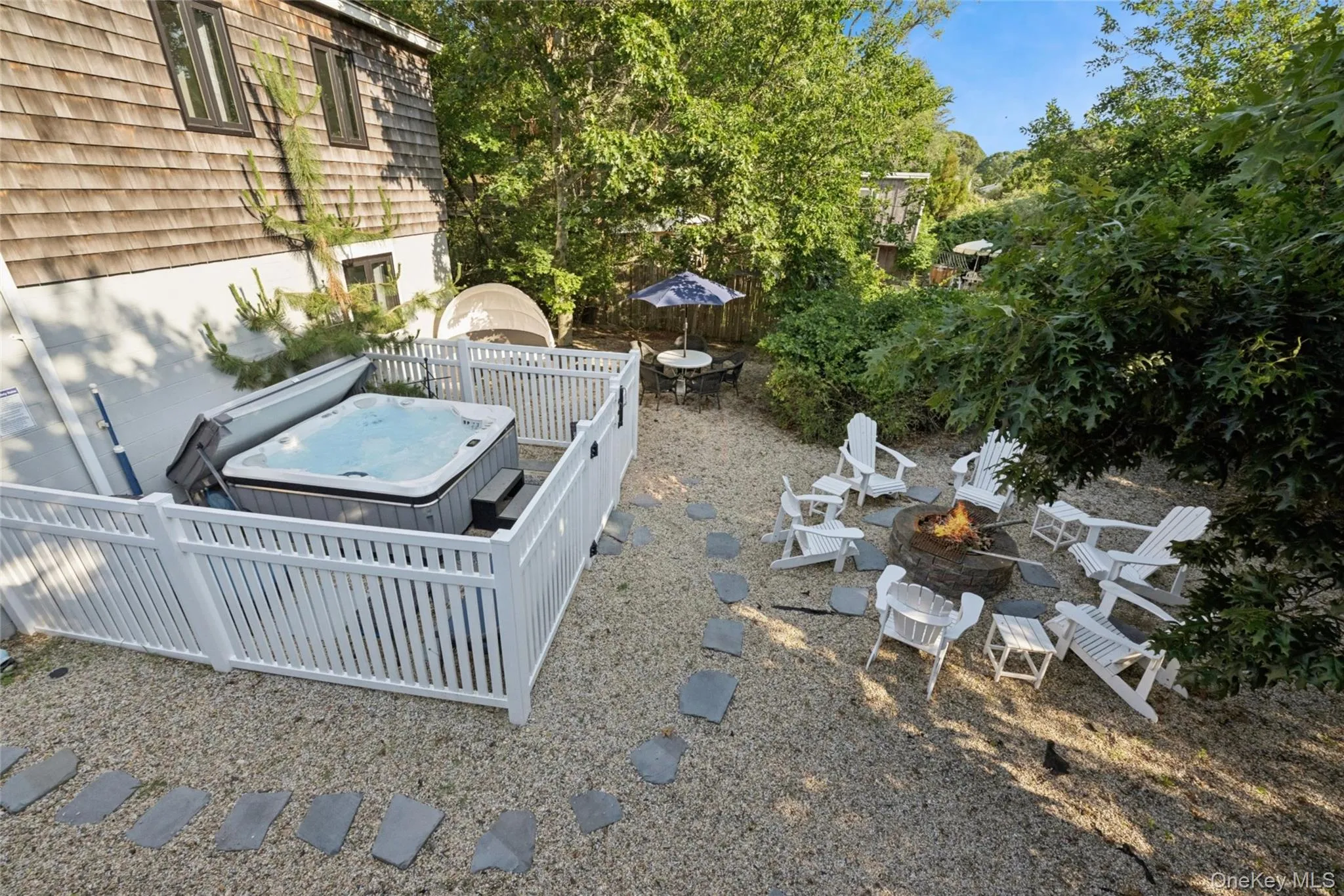 Rear yard with Hot tub, fire-pit and seating Rear yard with Hot tub, fire-pit and seating