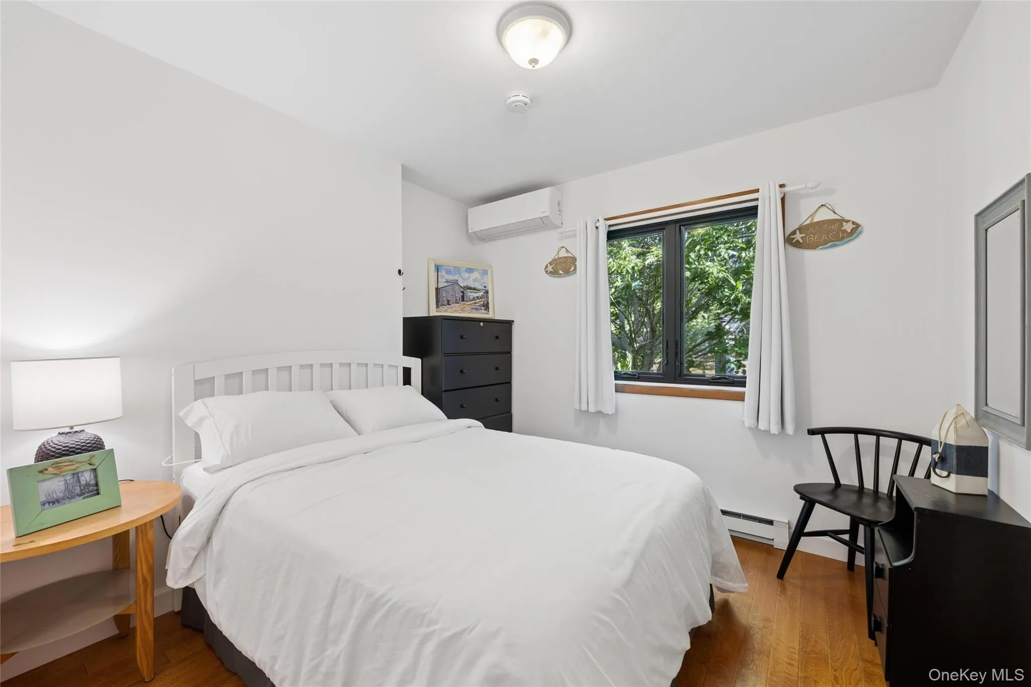 Hardwood-finish flooring complementing white walls Hardwood-finish flooring complementing white walls