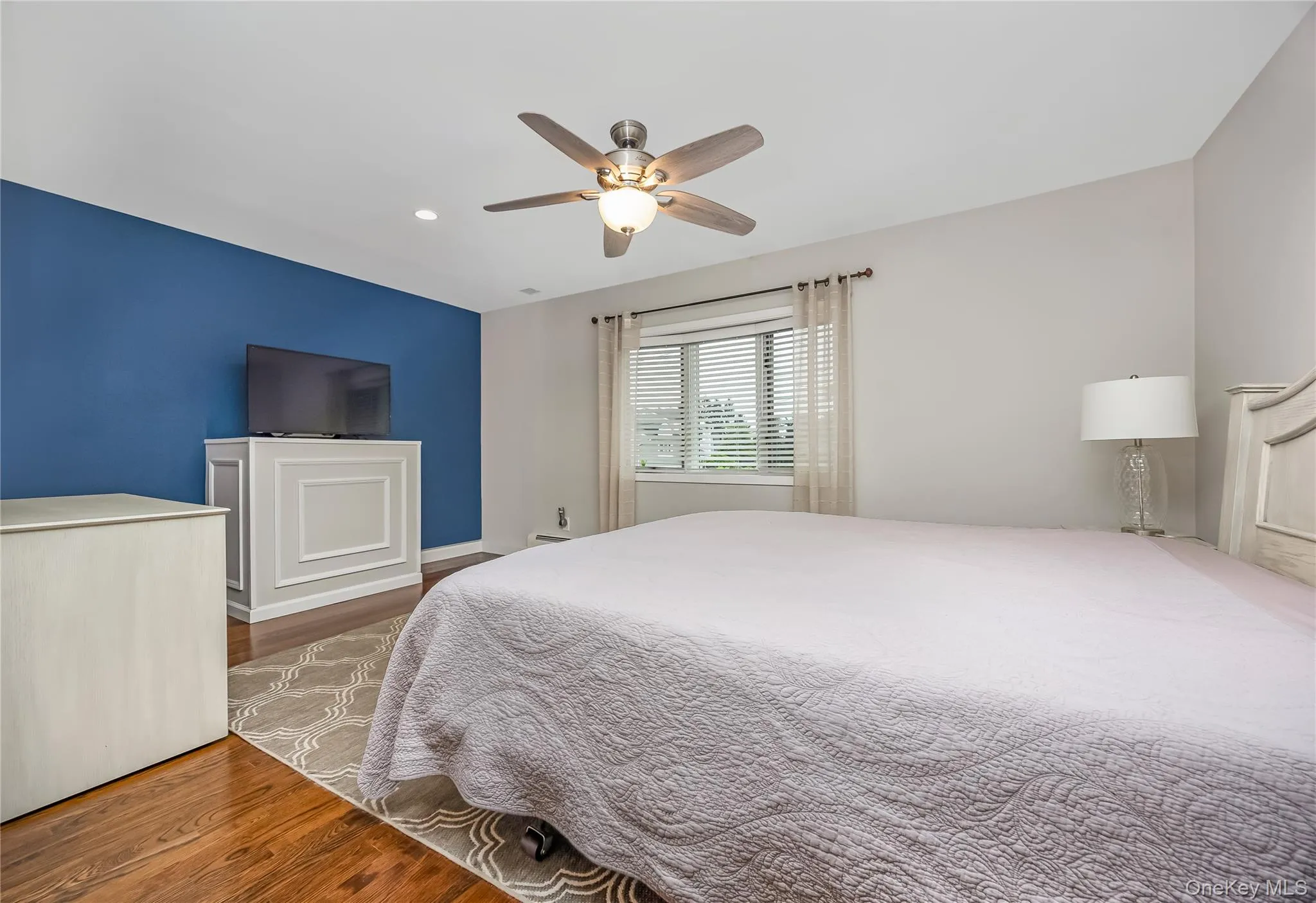 Spacious Primary Bedroom featuring hardwood flooring, recessed lighting, a ceiling fan, wic and sitting area that could be converted to a 4th bedroom Spacious Primary Bedroom featuring hardwood flooring, recessed lighting, a ceiling fan, wic and sitting area that could be converted to a 4th bedroom