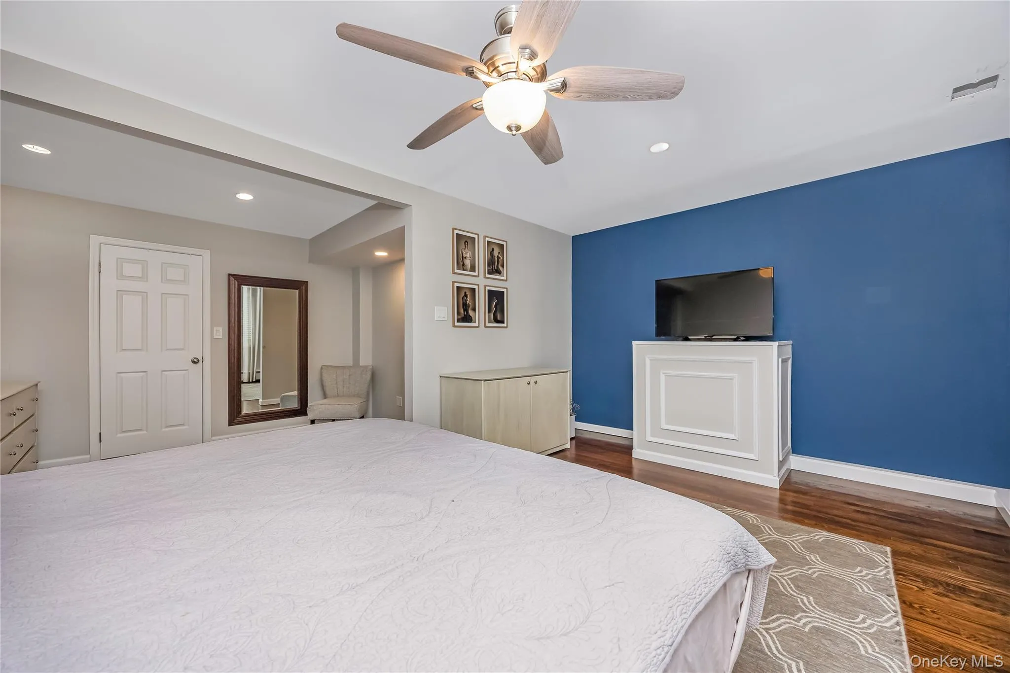 Spacious Primary Bedroom featuring hardwood flooring, recessed lighting, a ceiling fan, wic and sitting area that could be converted to a 4th bedroom Spacious Primary Bedroom featuring hardwood flooring, recessed lighting, a ceiling fan, wic and sitting area that could be converted to a 4th bedroom
