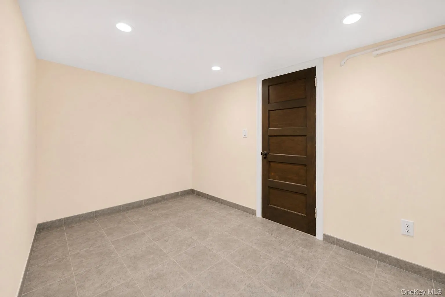 Private reception area for the dedicated office suite, featuring a separate entrance from the driveway and convenient access to an adjoining half bath. Private reception area for the dedicated office suite, featuring a separate entrance from the driveway and convenient access to an adjoining half bath.