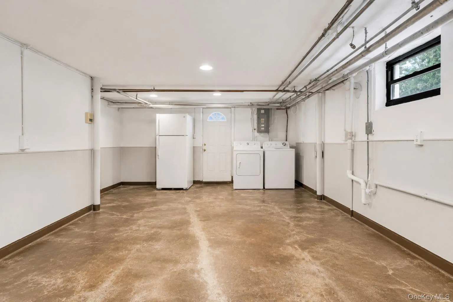 Basement Utility & Laundry RoomSpacious utility and laundry room with direct exterior access and abundant storage.Virtually enhanced. Basement Utility & Laundry RoomSpacious utility and laundry room with direct exterior access and abundant storage.Virtually enhanced.