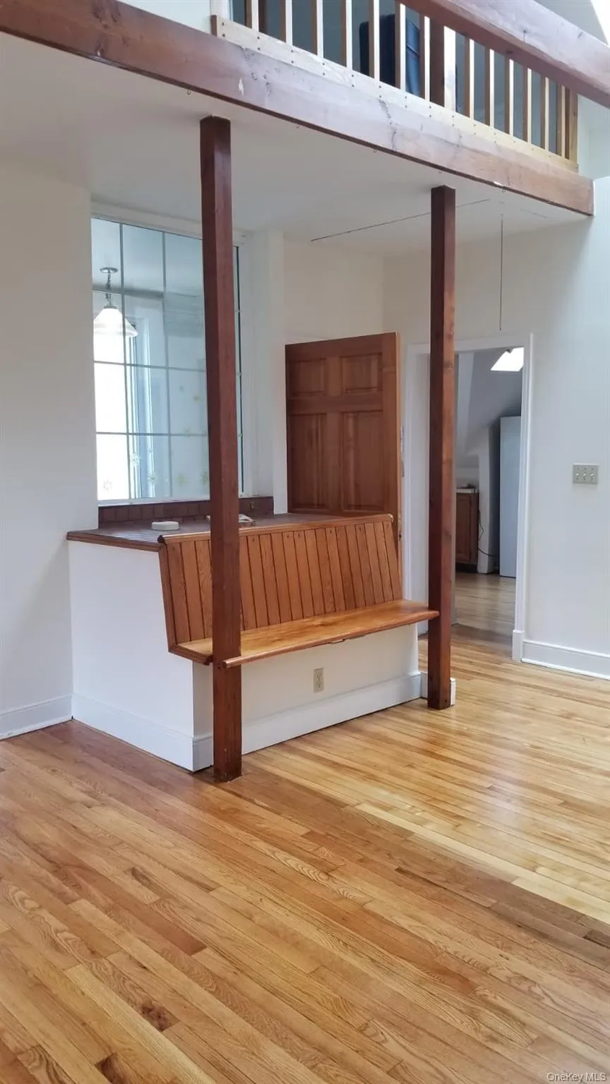 Living room with built in seating and pull down stairs loft space Living room with built in seating and pull down stairs loft space