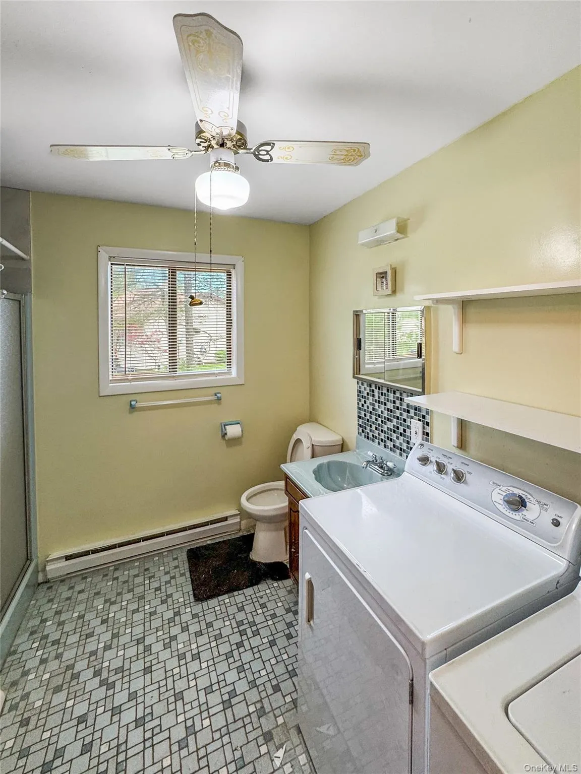 Bathroom with washer dryer, plenty of natural light Bathroom with washer dryer, plenty of natural light