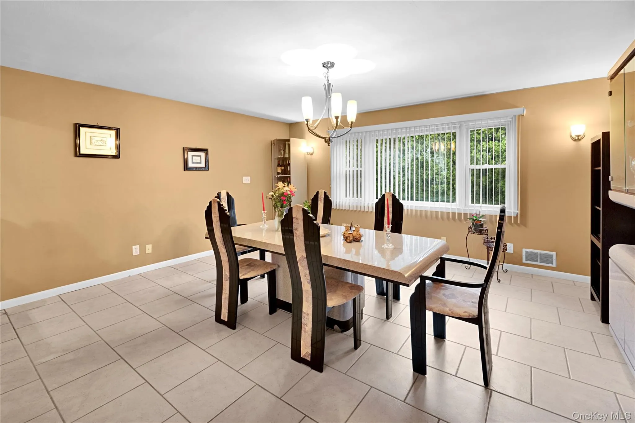Spacious room being used as the formal dining room, but could easily be set up as a family room! Spacious room being used as the formal dining room, but could easily be set up as a family room!