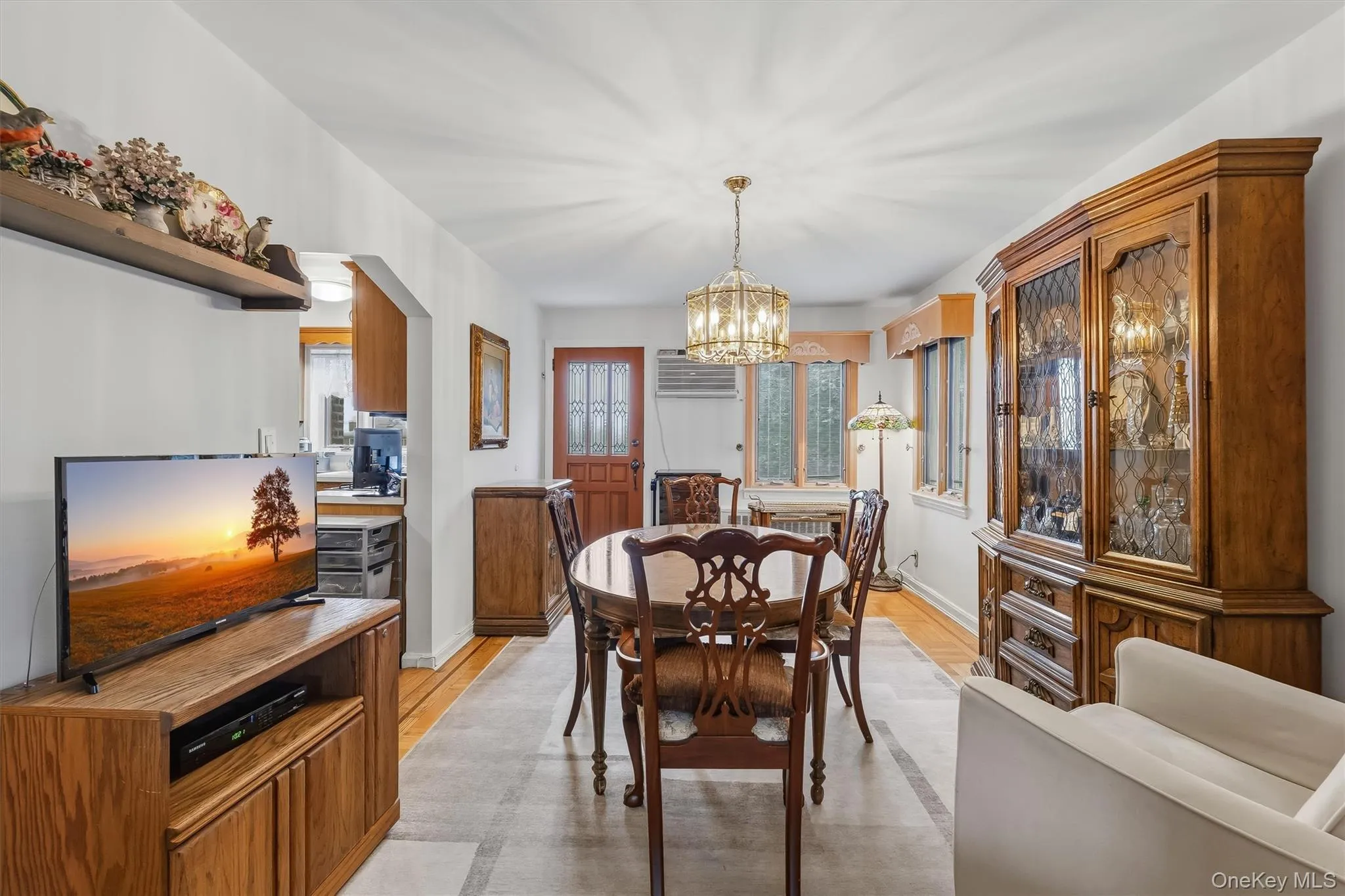 Dining room has a door to the back balcony. Dining room has a door to the back balcony.