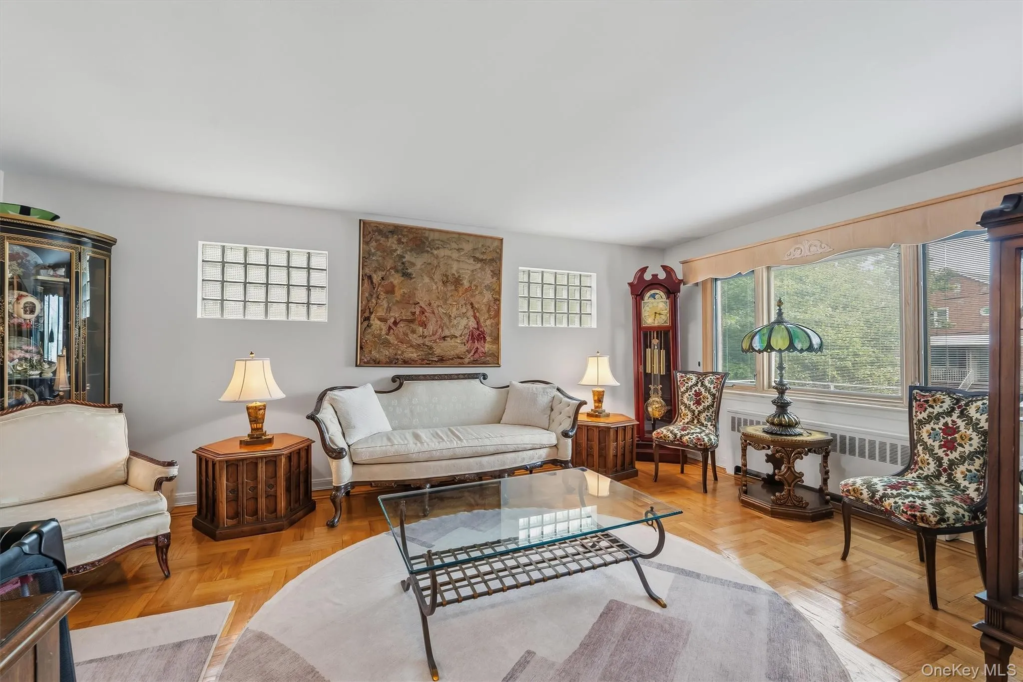 Bright & spacious living room with a picture window. Bright & spacious living room with a picture window.