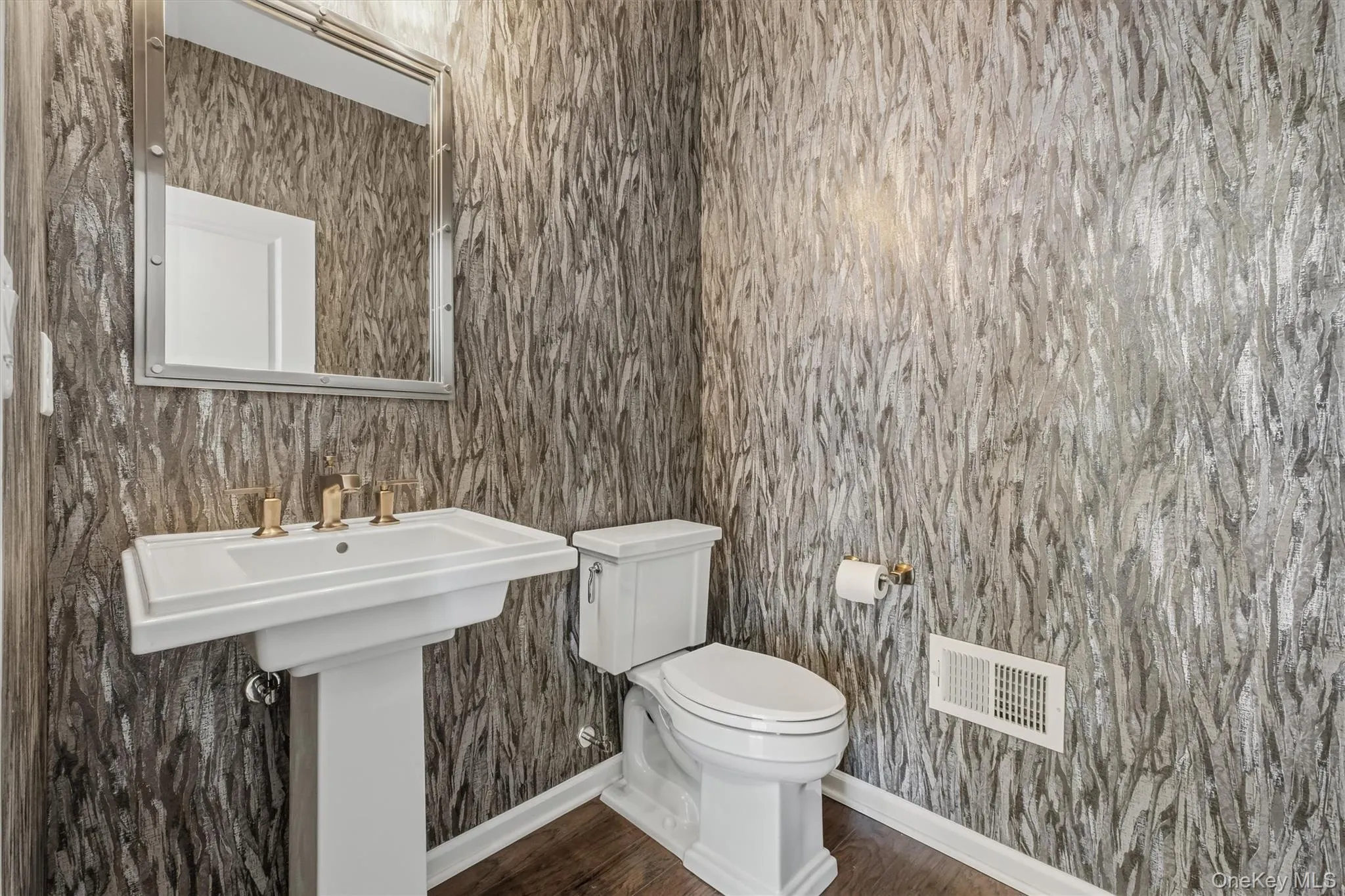 Half bath on first floor off the dining room. Half bath on first floor off the dining room.
