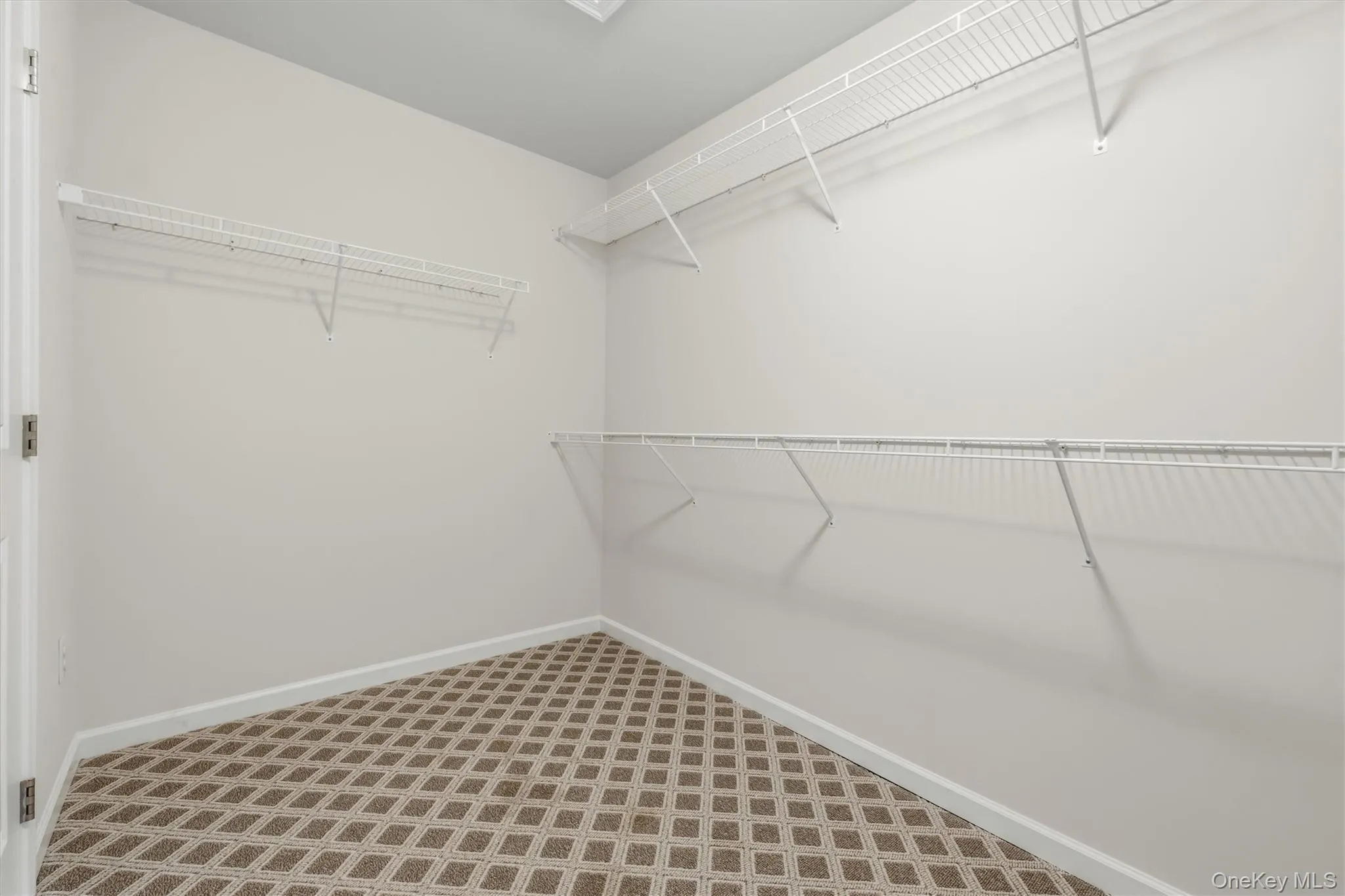Master bedroom walk-in closet. Master bedroom walk-in closet.