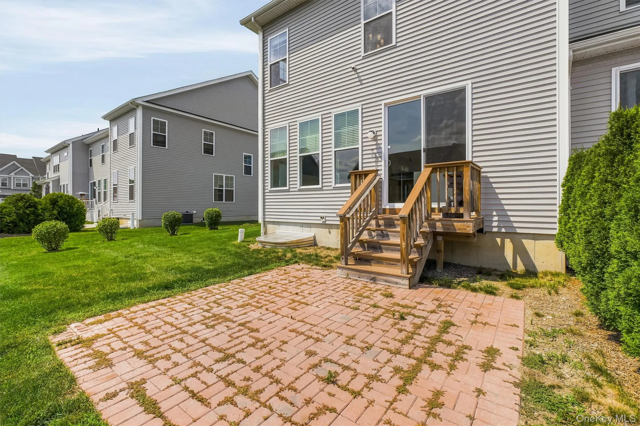 Rear sliding doors to brick patio. Rear sliding doors to brick patio.