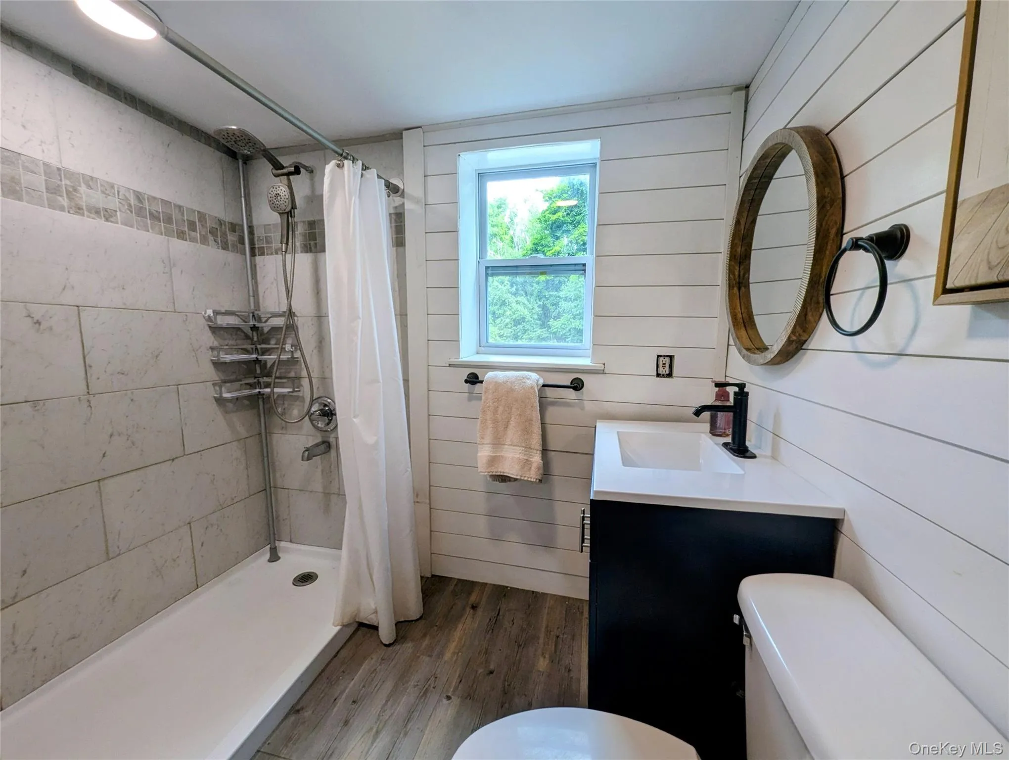 Updated bathroom with tile shower Updated bathroom with tile shower