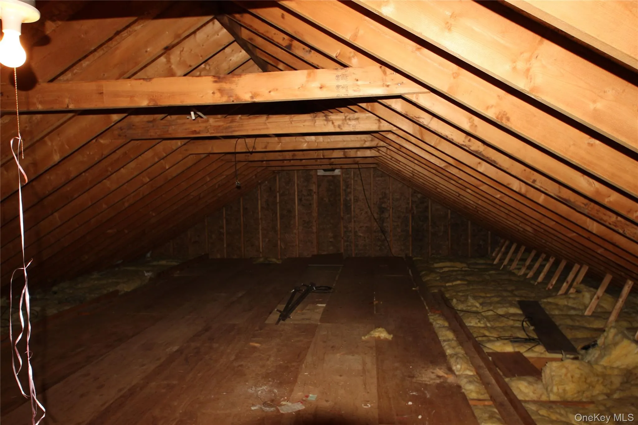 Exposed wooden rafters and beams showcasing structural elements Exposed wooden rafters and beams showcasing structural elements