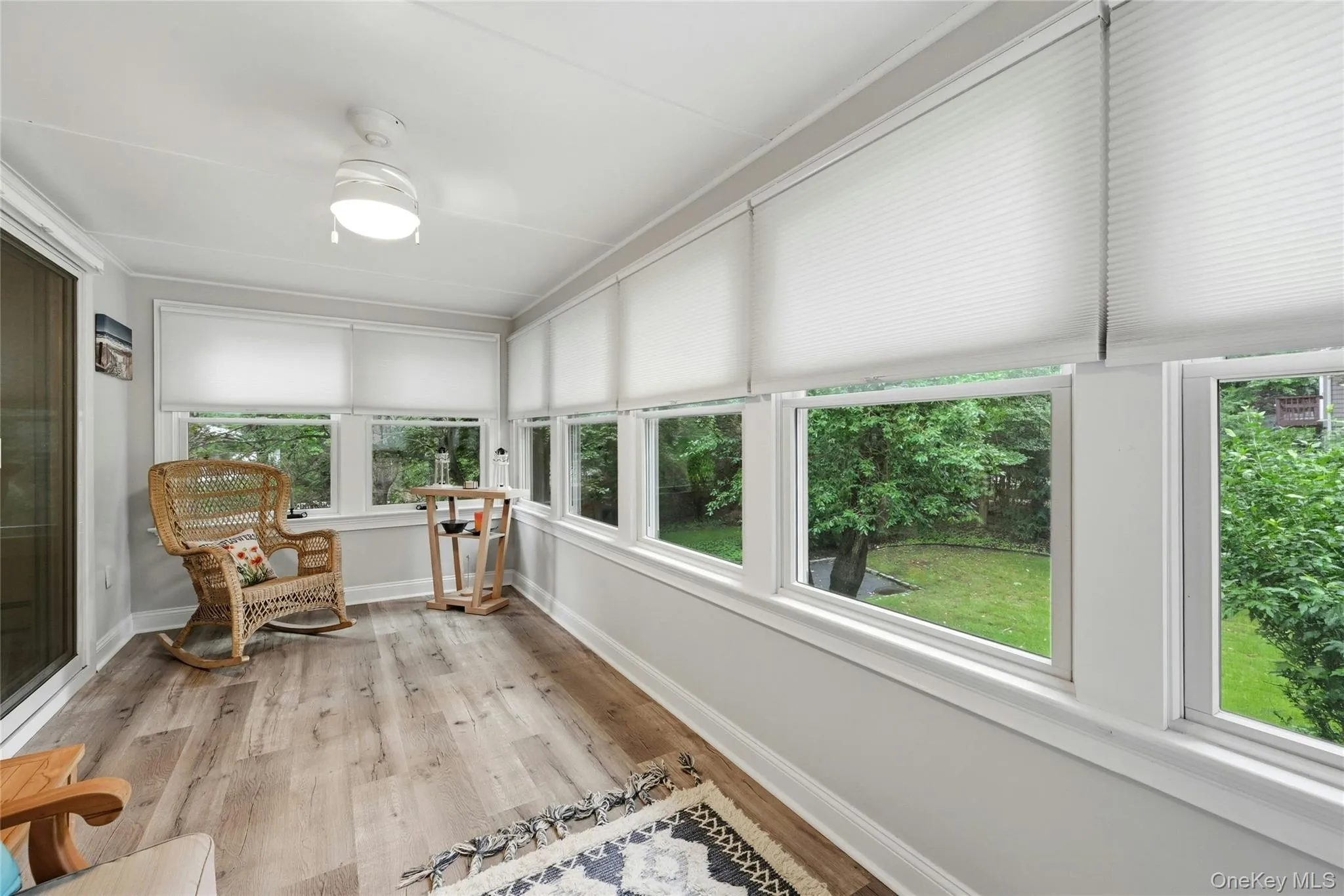 Sliding Doors Off Of The Formal Dining Room Lead To A Wonderful Sunroom/Reading Room With Walls Of Windows Overlooking The Backyard. Sliding Doors Off Of The Formal Dining Room Lead To A Wonderful Sunroom/Reading Room With Walls Of Windows Overlooking The Backyard.