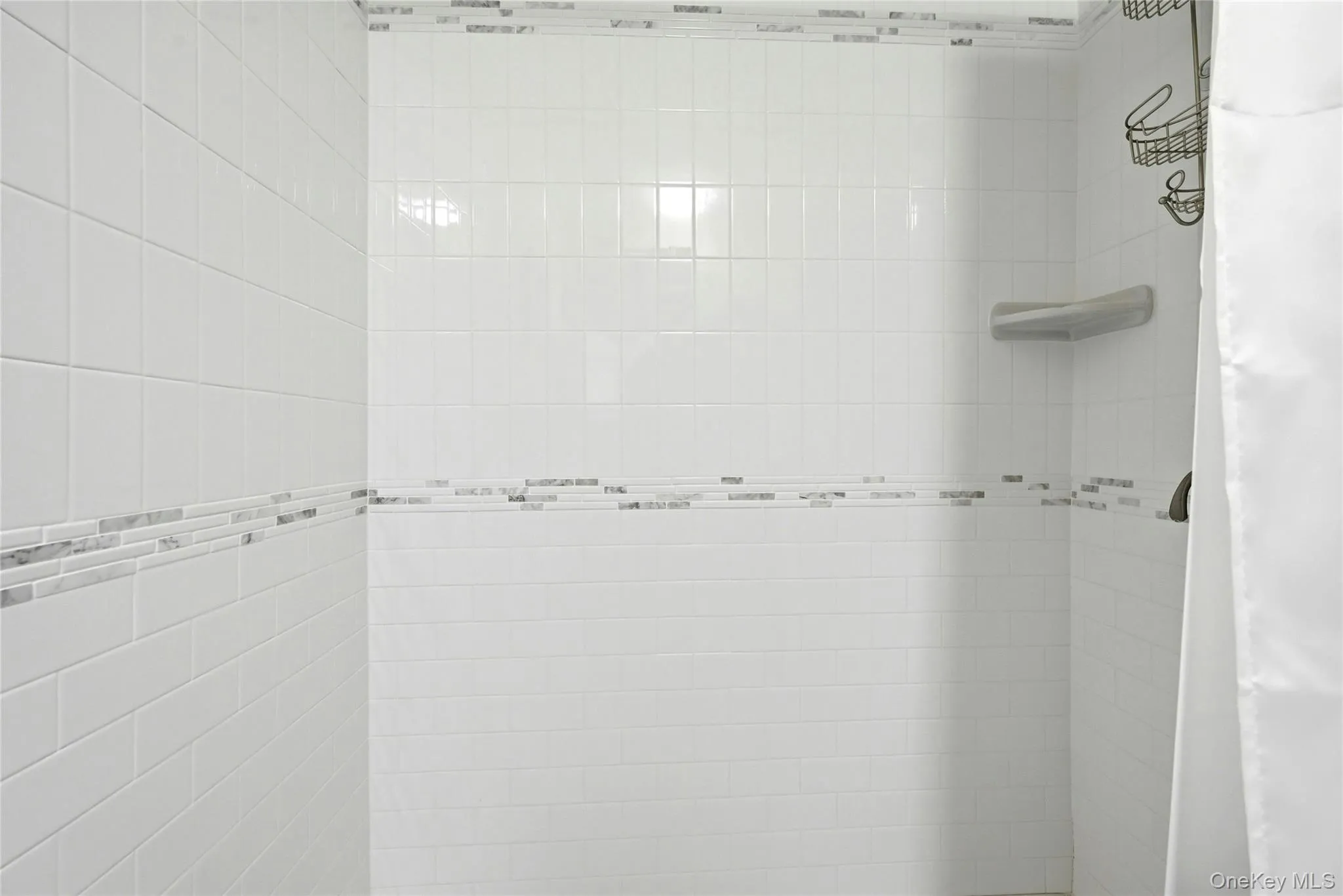 The Oversized Custom Shower In The Main Floor Full Bathroom With All Beautiful Tilework & Two Accent Borders. The Oversized Custom Shower In The Main Floor Full Bathroom With All Beautiful Tilework & Two Accent Borders.