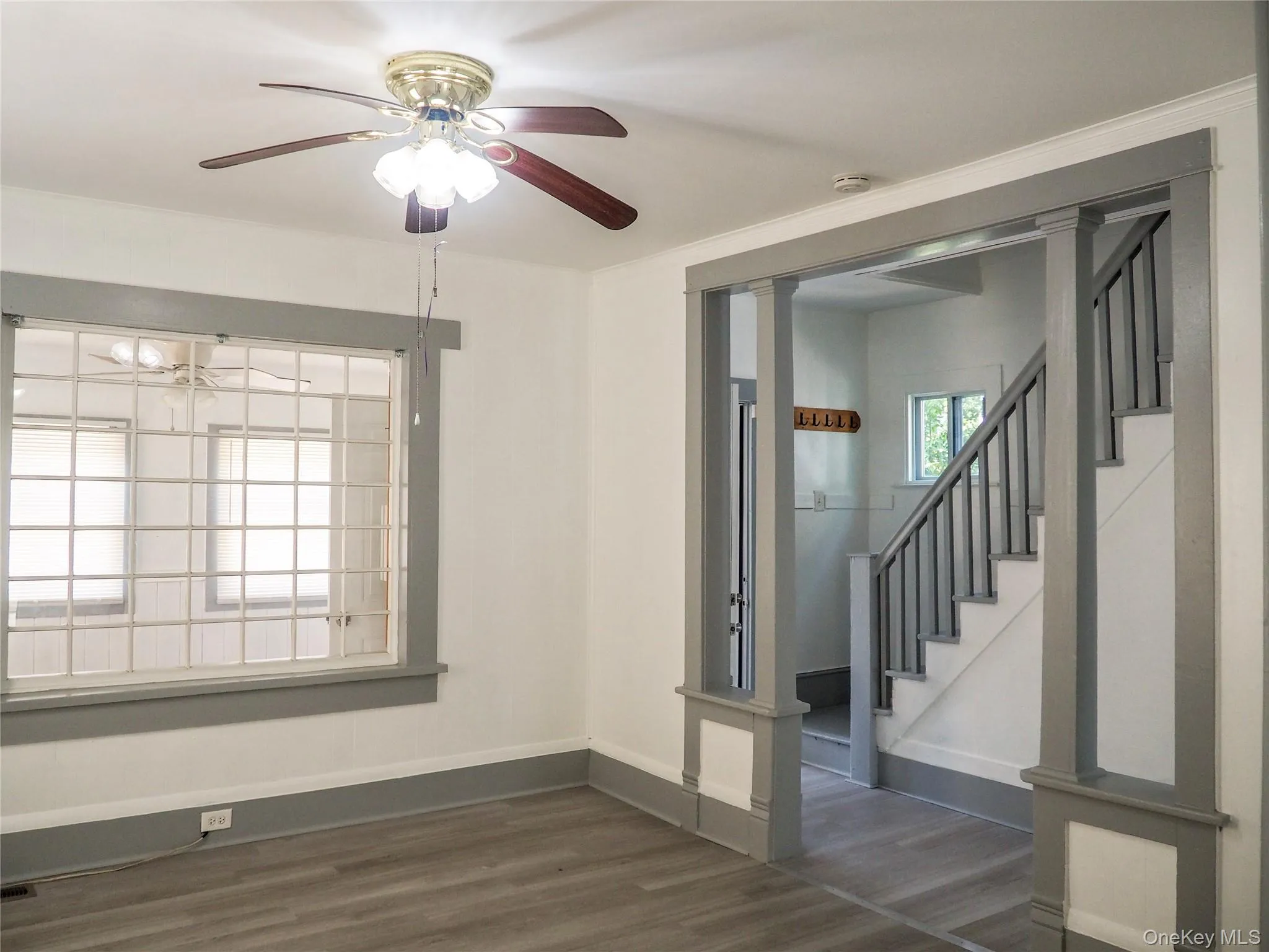 This is the living room adjacent to the front foyer and stairway. This is the living room adjacent to the front foyer and stairway.