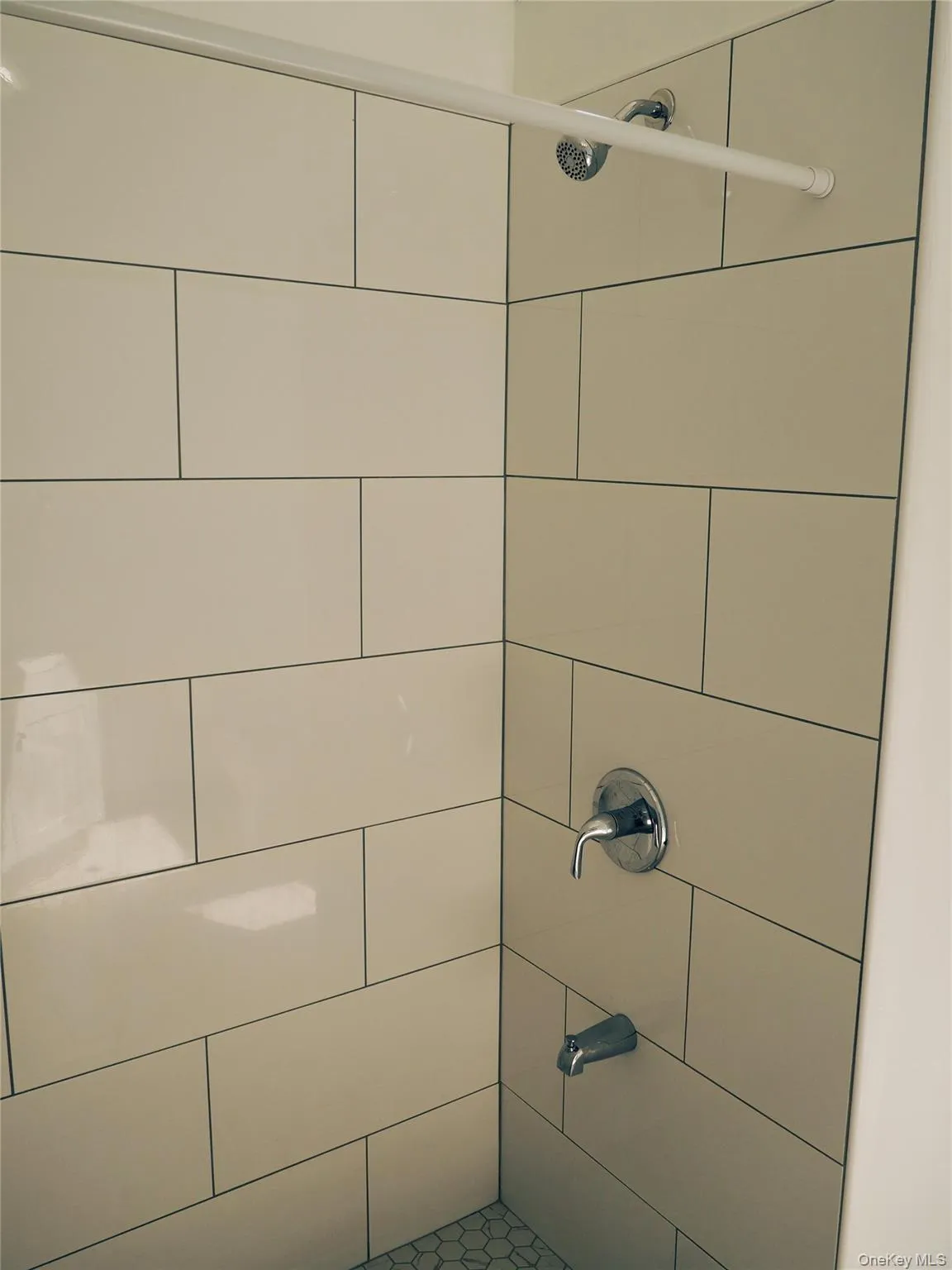 New tile walk in showers are highlights of both of the bathrooms in this home. New tile walk in showers are highlights of both of the bathrooms in this home.