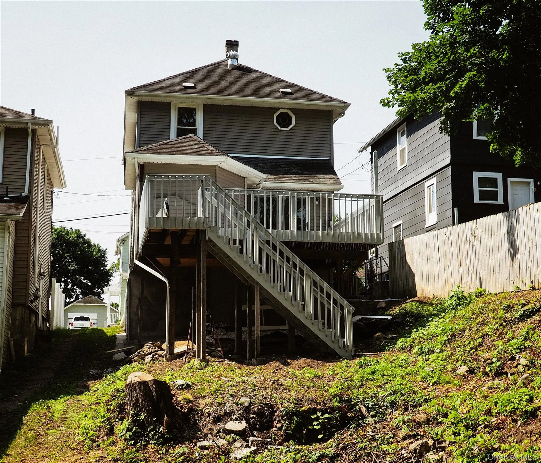 The rear of this home is highlighted by it's large railed deck, that will perfect for outdoor enjoyment and entertaining. The rear of this home is highlighted by it's large railed deck, that will perfect for outdoor enjoyment and entertaining.