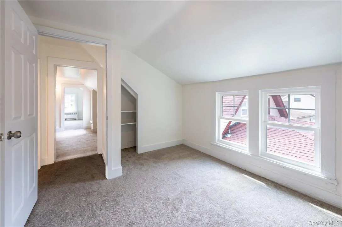 Another view of bedroom 4 which offers plenty of natural light, and carpet floors Another view of bedroom 4 which offers plenty of natural light, and carpet floors