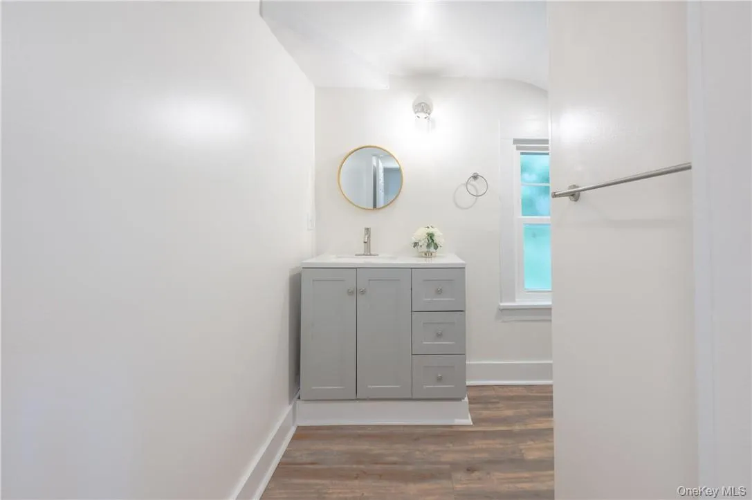 Third floor full bathroom featuring vanity and full bath with a shower Third floor full bathroom featuring vanity and full bath with a shower
