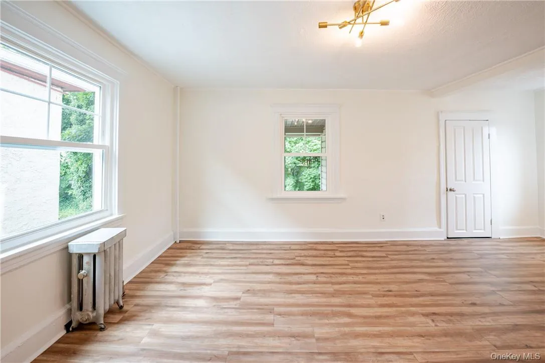 A large living room is adjacent to the dining room and kitchen - makes entertaining a snap! A large living room is adjacent to the dining room and kitchen - makes entertaining a snap!