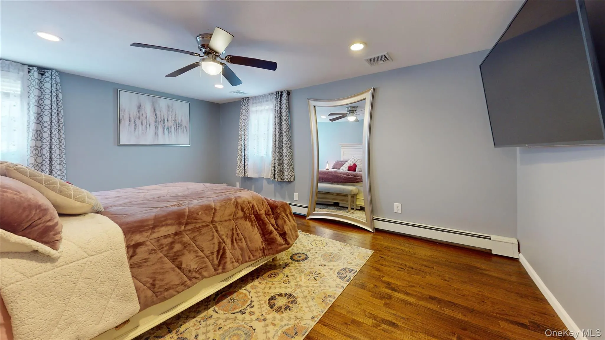 The primary bedroom with hardwood flooring is spacious and spotless! The primary bedroom with hardwood flooring is spacious and spotless!