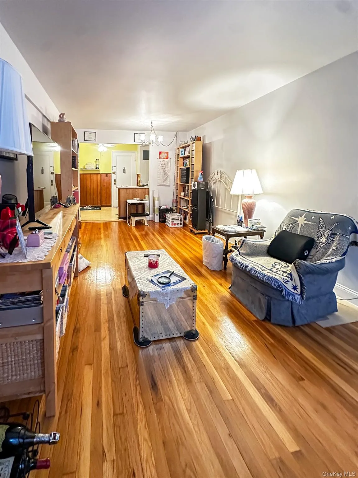 Living Room + Dining Area Light wood-finish flooring throughout, complemented by light-toned wall finishes Living Room + Dining Area Light wood-finish flooring throughout, complemented by light-toned wall finishes