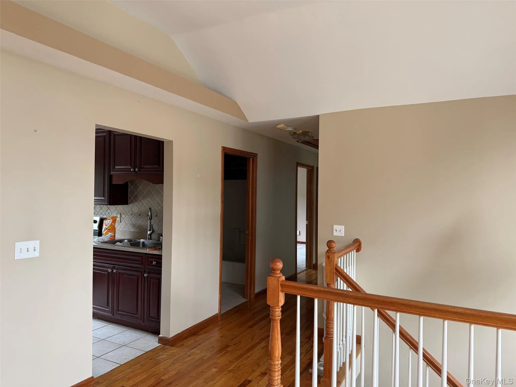 Entrance to first level showing the kitchen entrance and hallway to bedrooms Entrance to first level showing the kitchen entrance and hallway to bedrooms