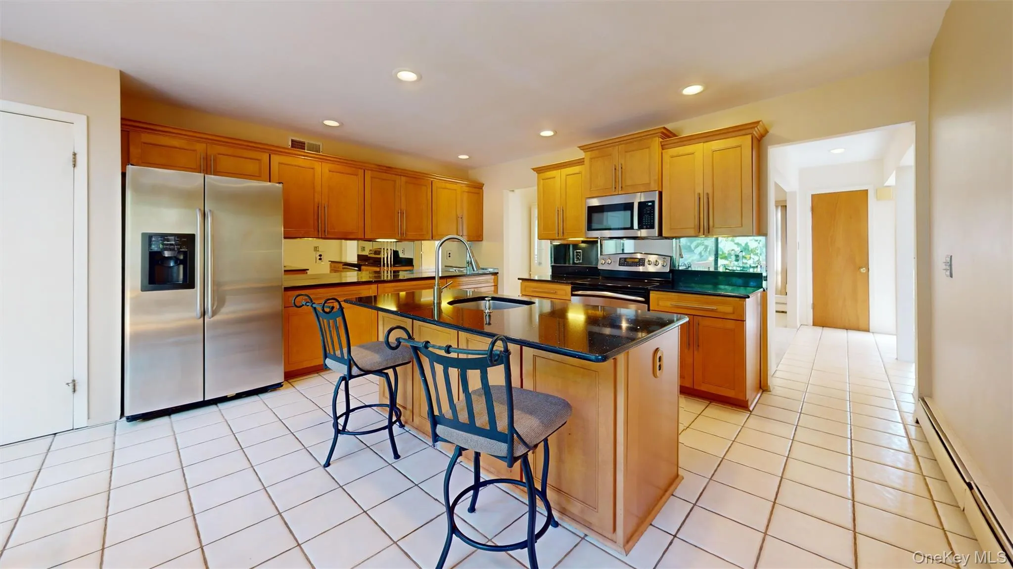 Updated kitchen features marble countertops and custom appliances! Updated kitchen features marble countertops and custom appliances!