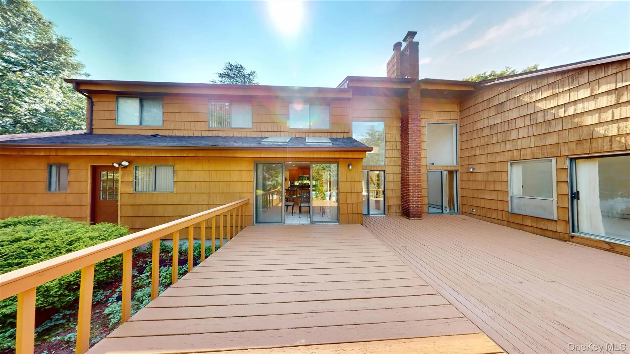The large rear deck leads to an in-ground pool and spacious, treed backyard. The large rear deck leads to an in-ground pool and spacious, treed backyard.