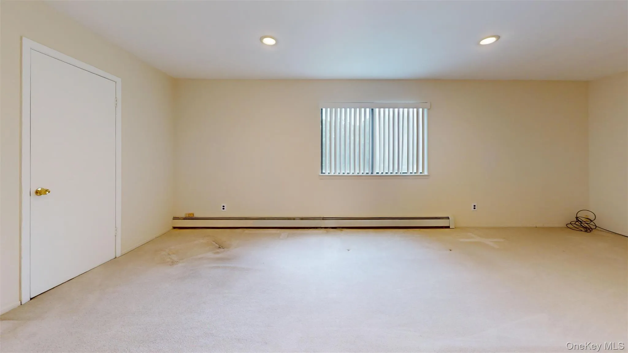 Second view of the family room, shows the door to the adjoining large interior storage space. Second view of the family room, shows the door to the adjoining large interior storage space.