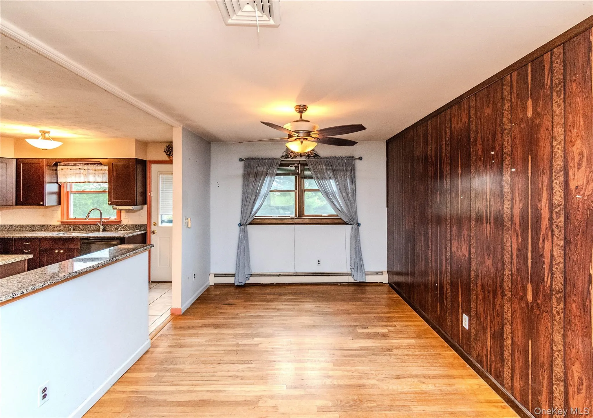 Dinging area - wall panel and hardwood floors Dinging area - wall panel and hardwood floors