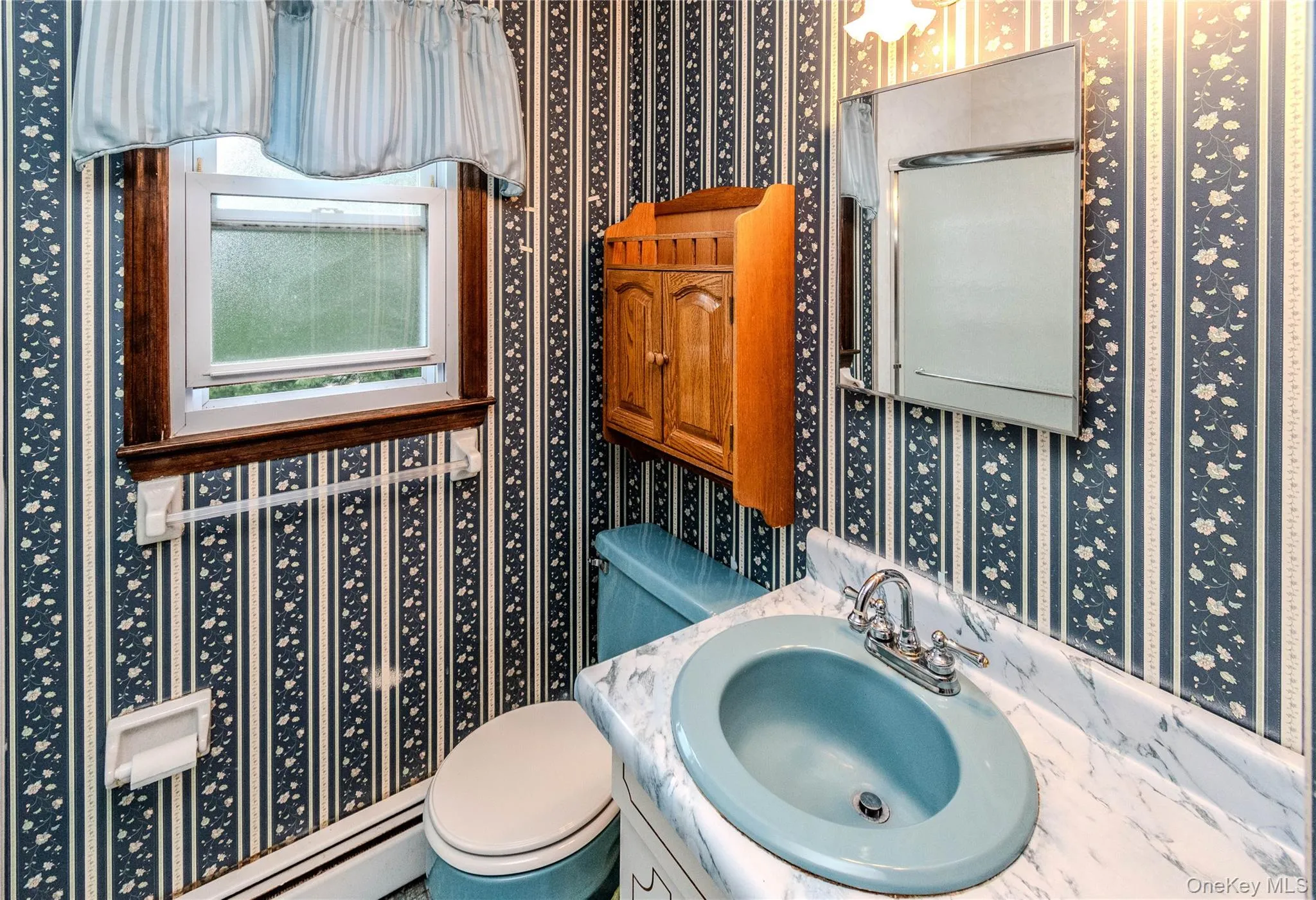 Bathroom 1 - Single vanity sink with walk in shower. Door connects to ensuite half bathroom. Bathroom 1 - Single vanity sink with walk in shower. Door connects to ensuite half bathroom.