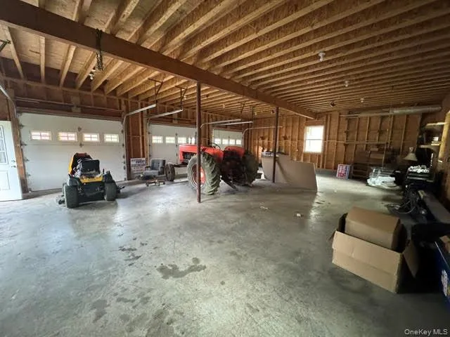 View of the 1st floor interior of the garage. View of the 1st floor interior of the garage.