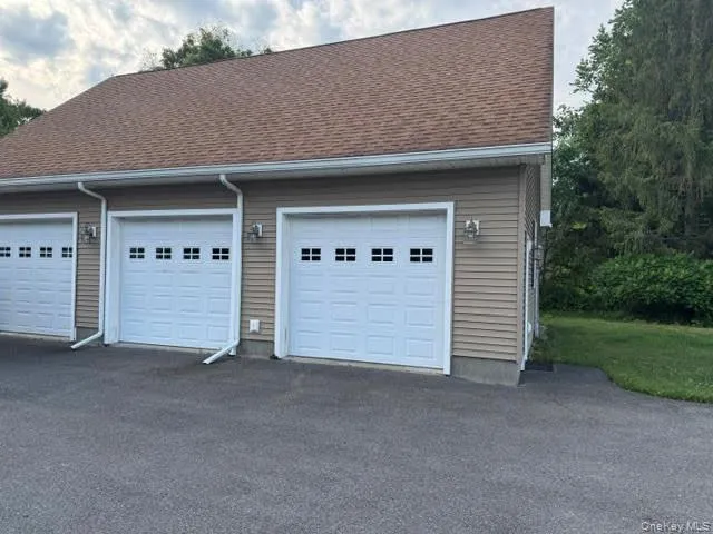 View of the three overhead doors. View of the three overhead doors.