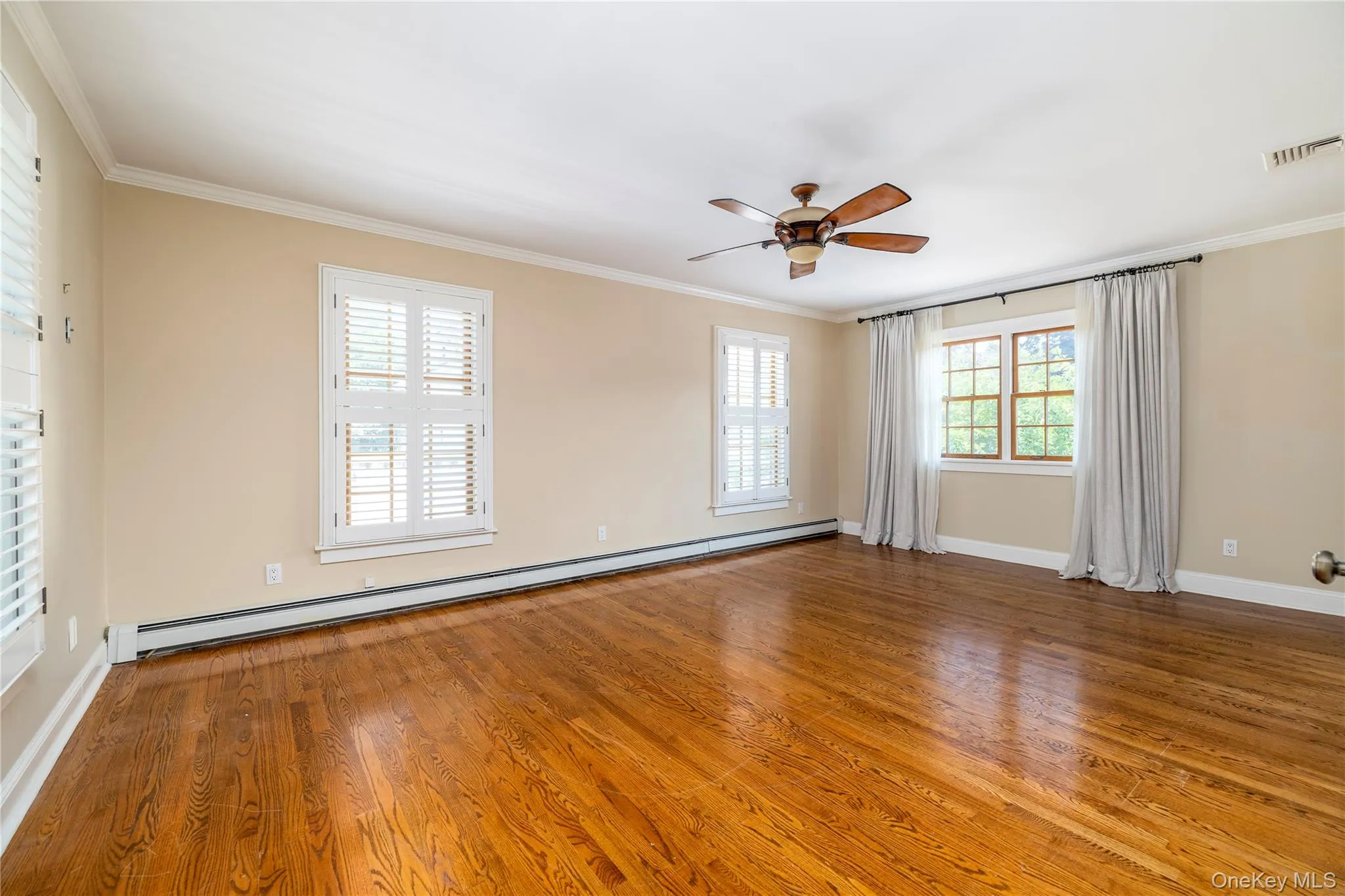 Large Primary Bedroom w/ Custom Shutters Large Primary Bedroom w/ Custom Shutters
