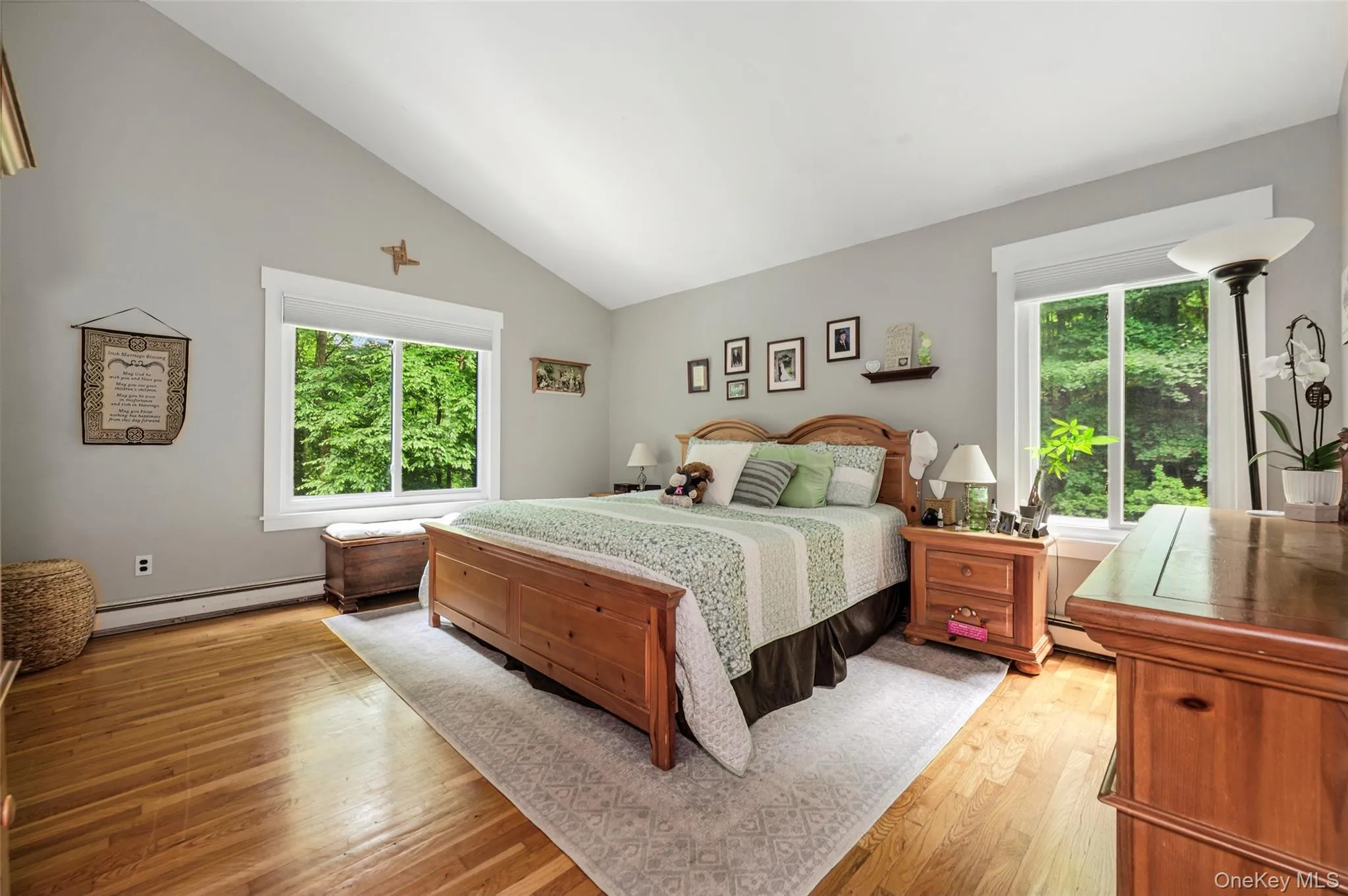 Primary bedroom with cathedral ceilings. Primary bedroom with cathedral ceilings.