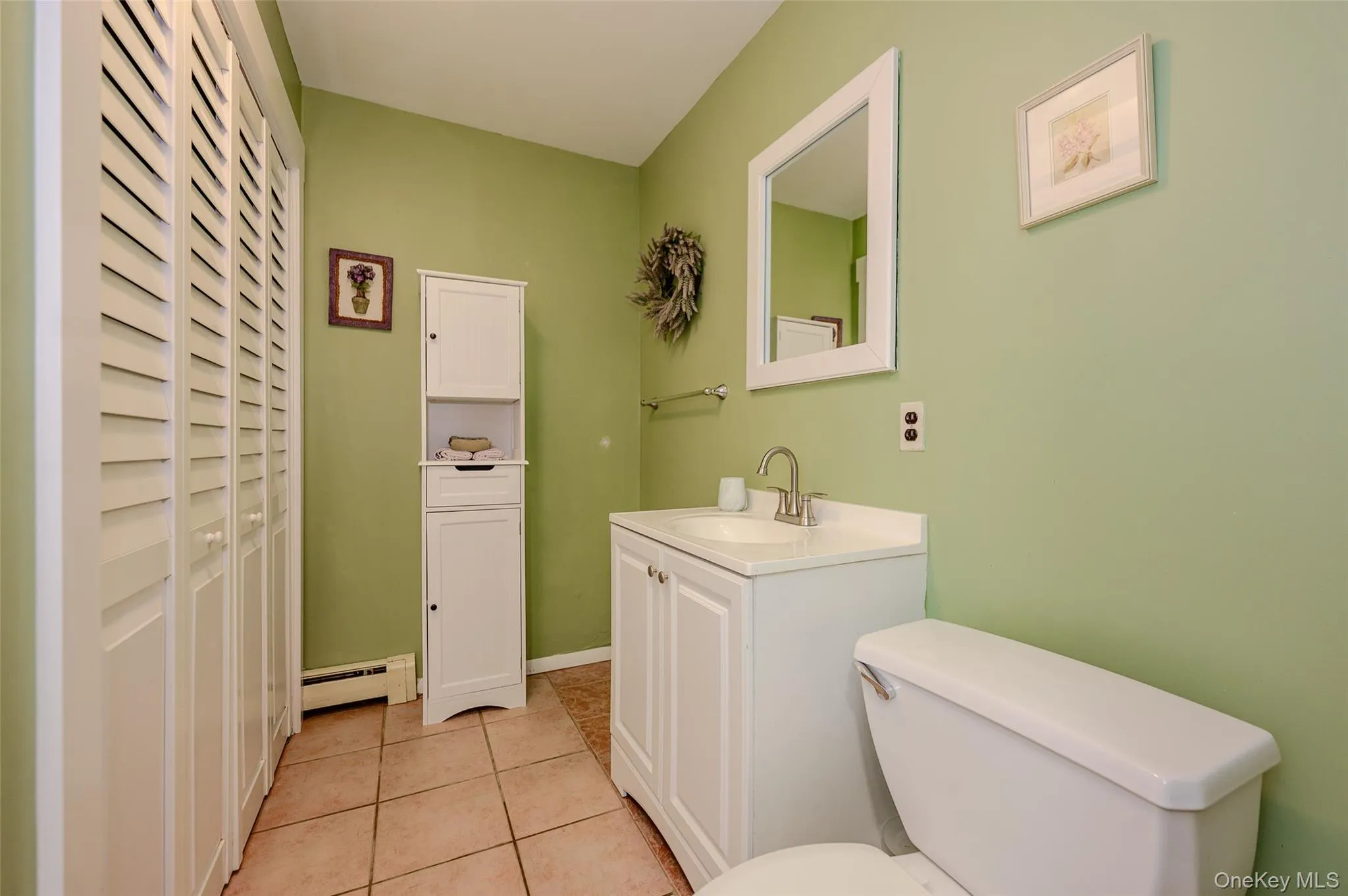 Lower level half-bath with laundry. Lower level half-bath with laundry.