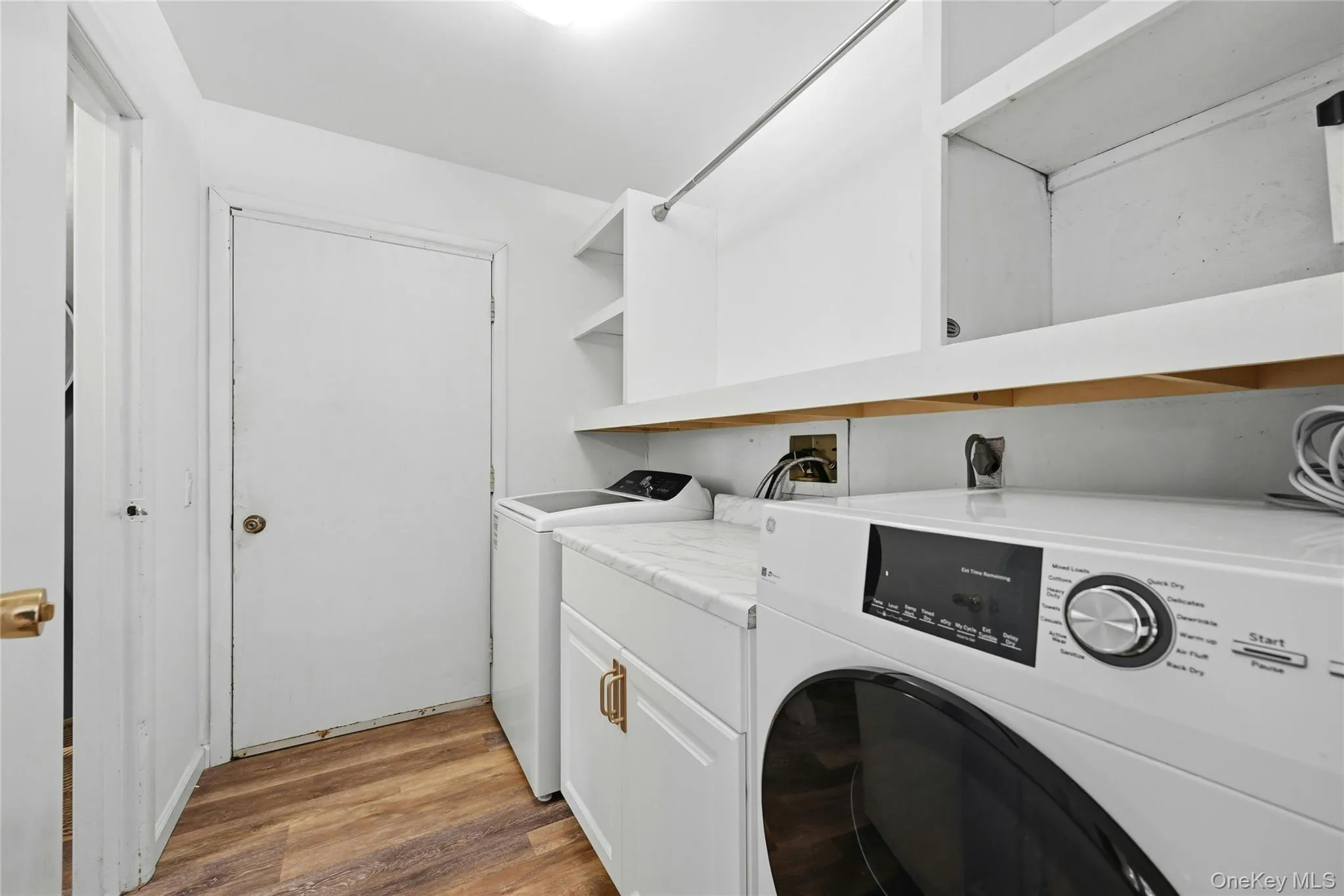 Main floor Laundry Room, with storage and folding station Main floor Laundry Room, with storage and folding station