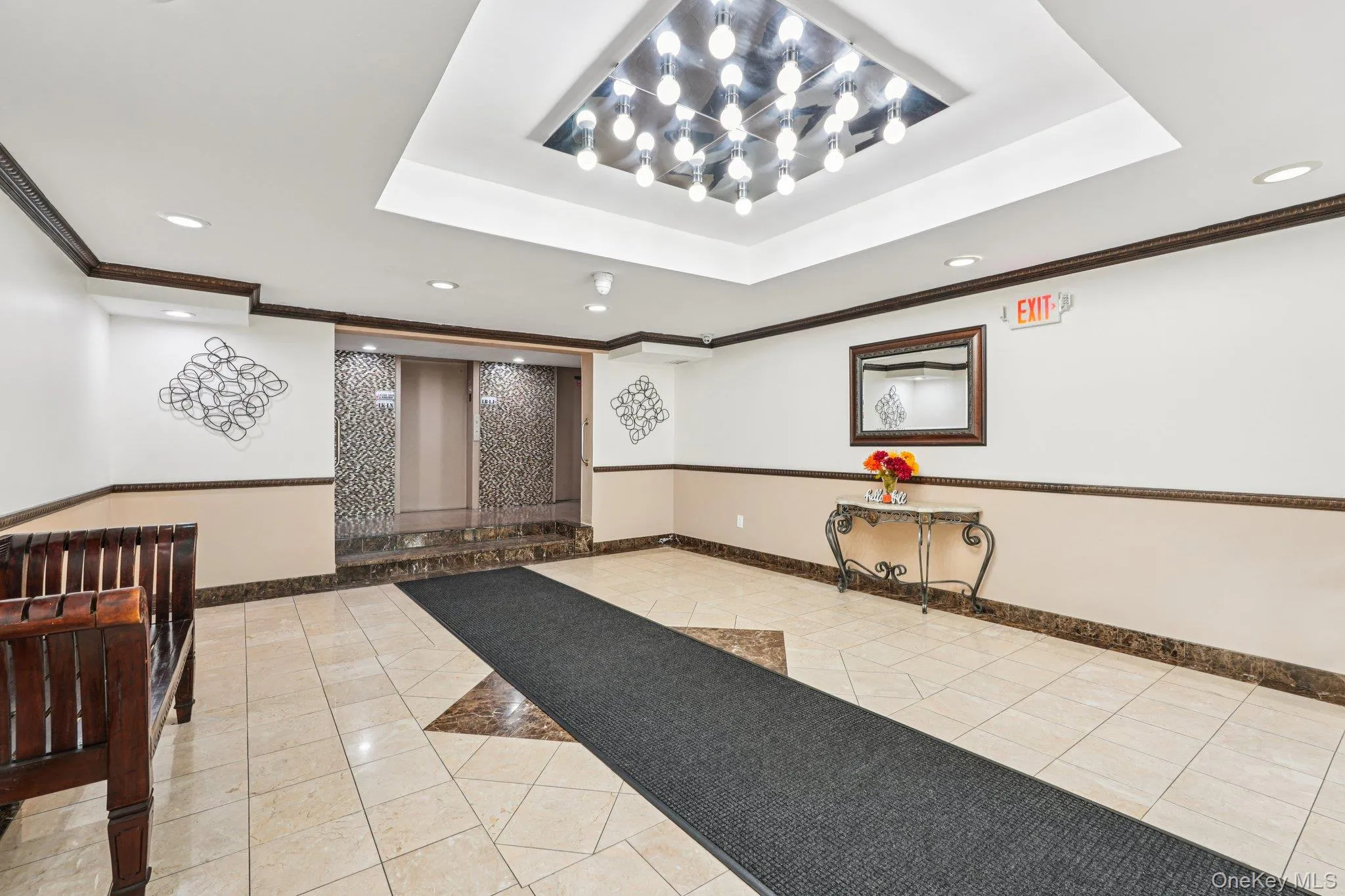 Secured lobby with crown molding, and recessed lighting Secured lobby with crown molding, and recessed lighting